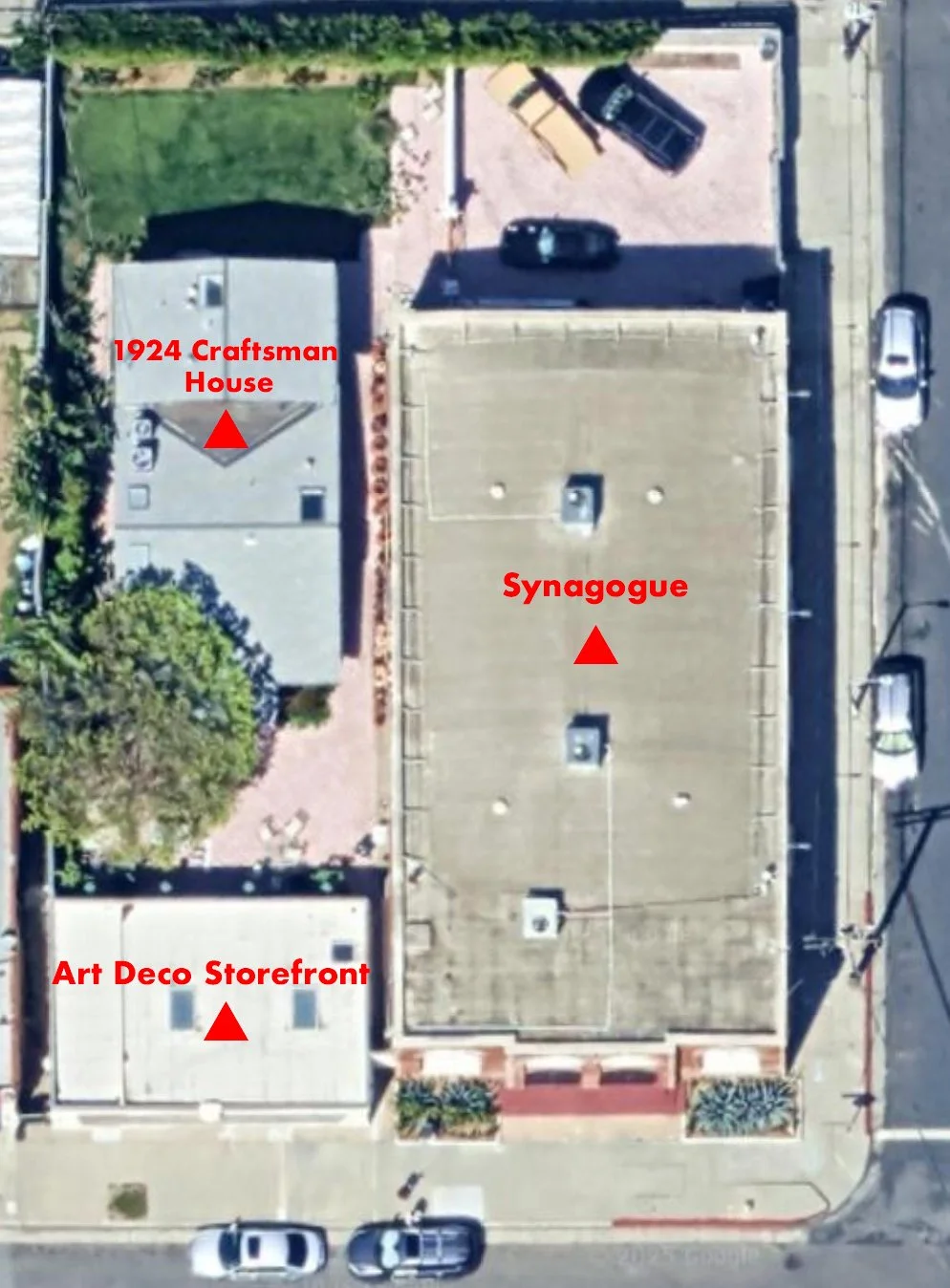 Aerial view of a building complex showing a 1924 Craftsman house, a large synagogue in the center, and an Art Deco storefront at the bottom. The image includes parking lots and streets surrounding the buildings.