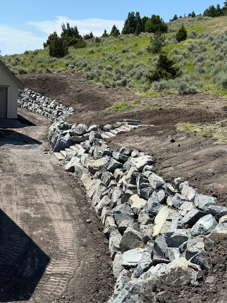 Boulder retaining wall and hardscaping by Keystone Contracting in Big Sky MT