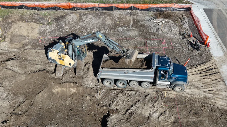 Aerial view of trucking and material hauling for a Gallatin Valley job site