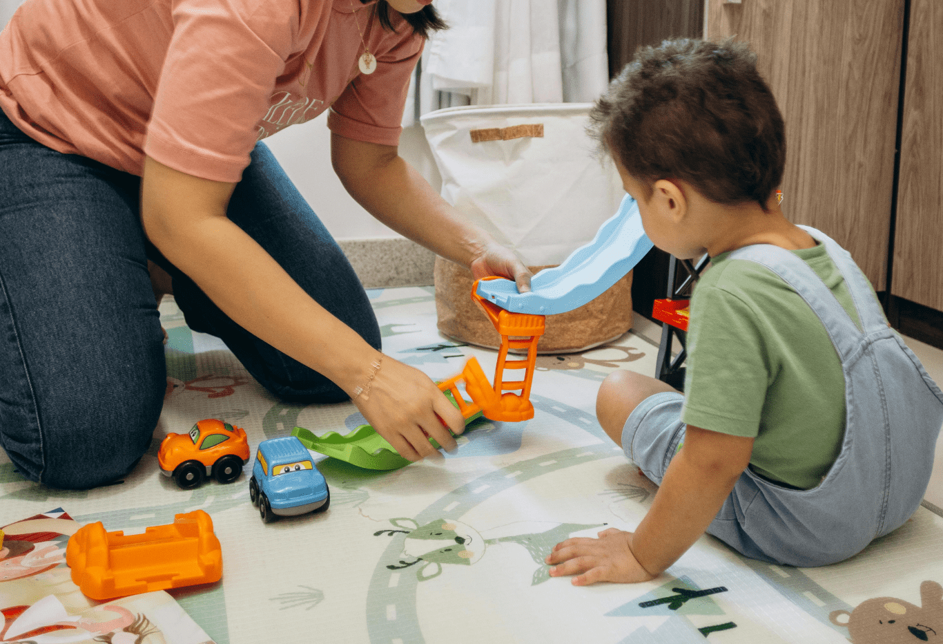 Child playing with colorful building toys during playtime