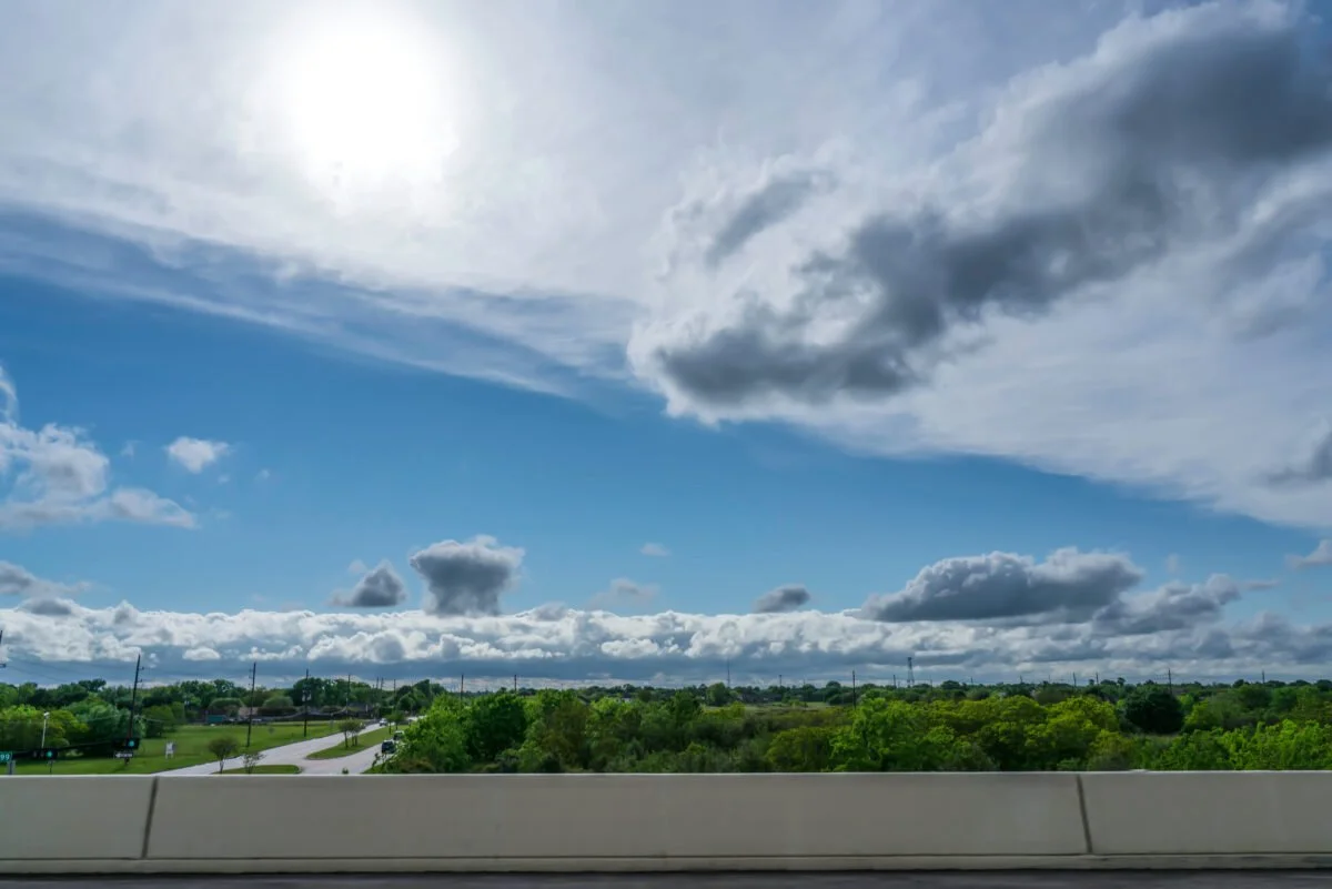 Horizon view of Katy' TX with blue sky and lots of fluffy, white clouds