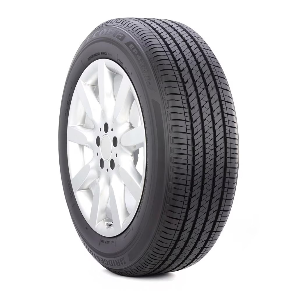 New black tire with silver alloy wheel.