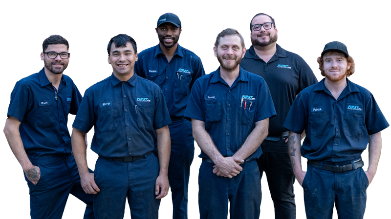 Six men wearing blue uniforms with FIRST logos, standing together and smiling at the camera.