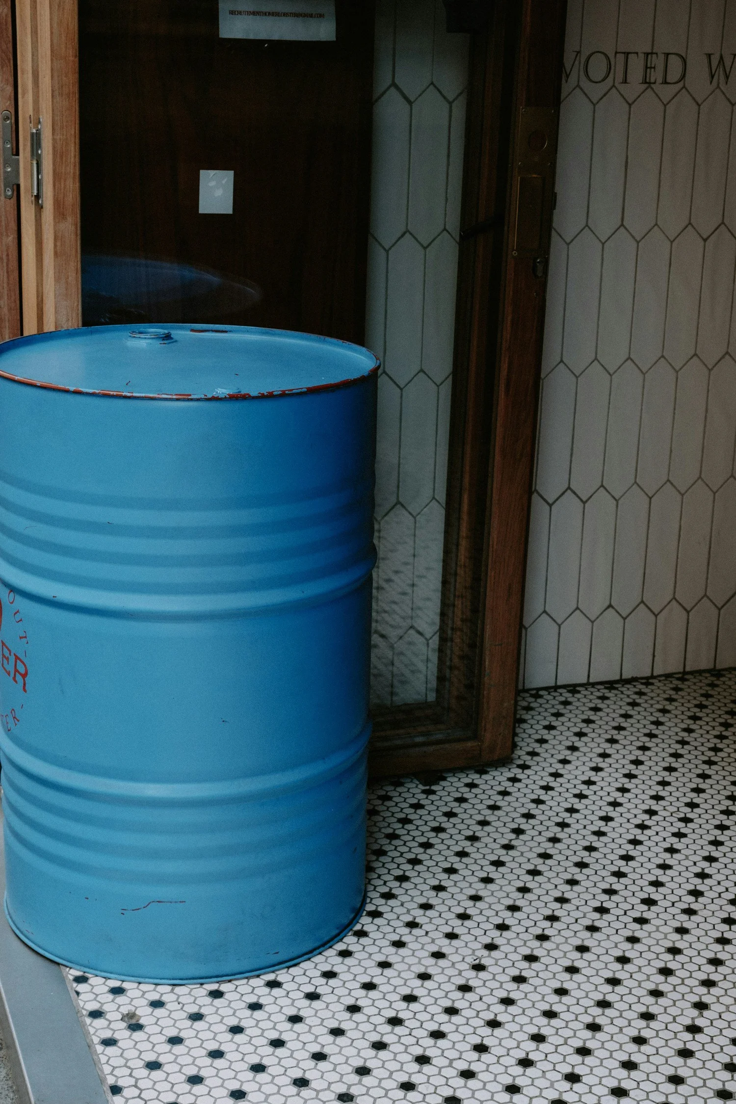 A blue steel 55-gallon drum.