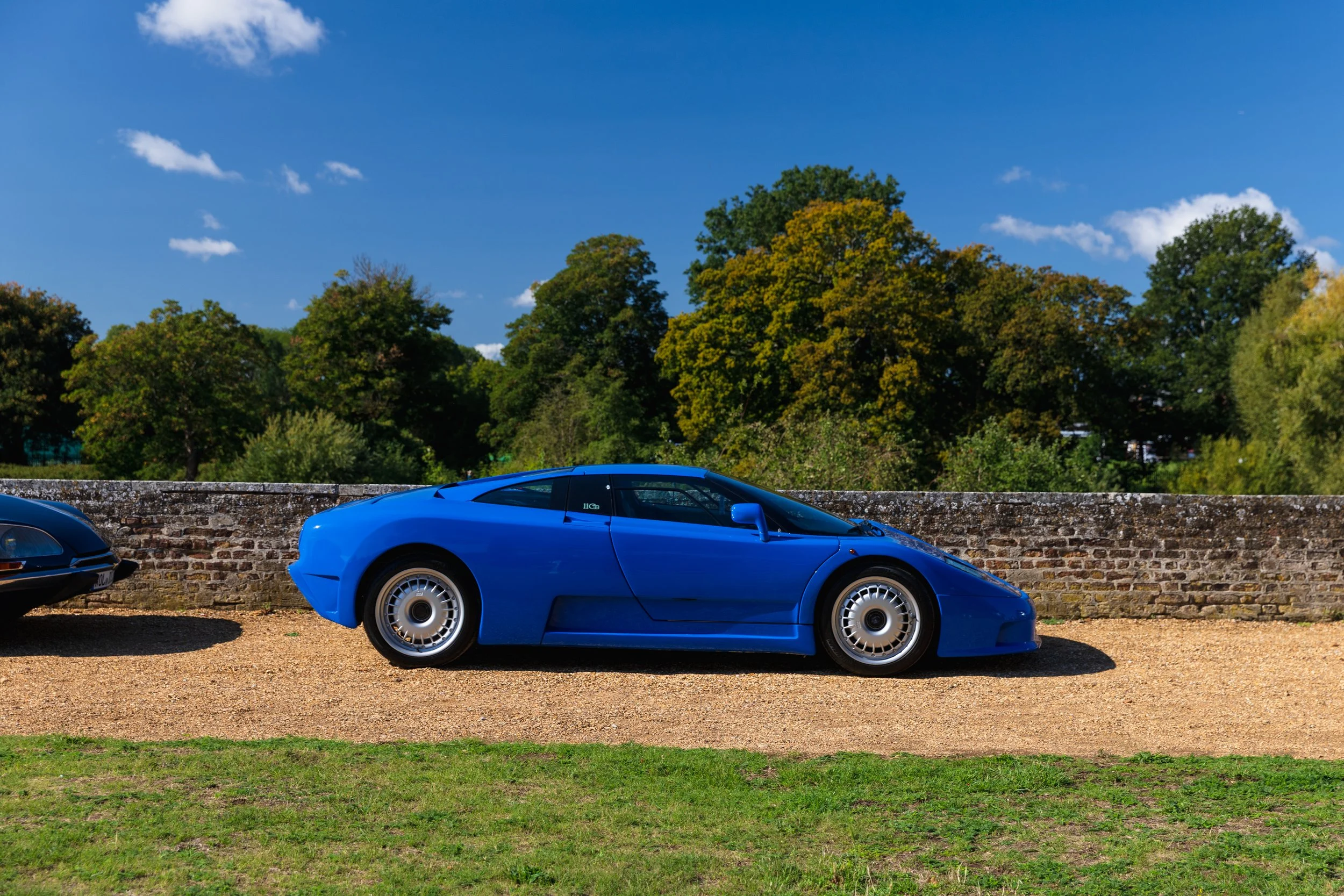 Yes, that is another Blue Bugatti EB110!