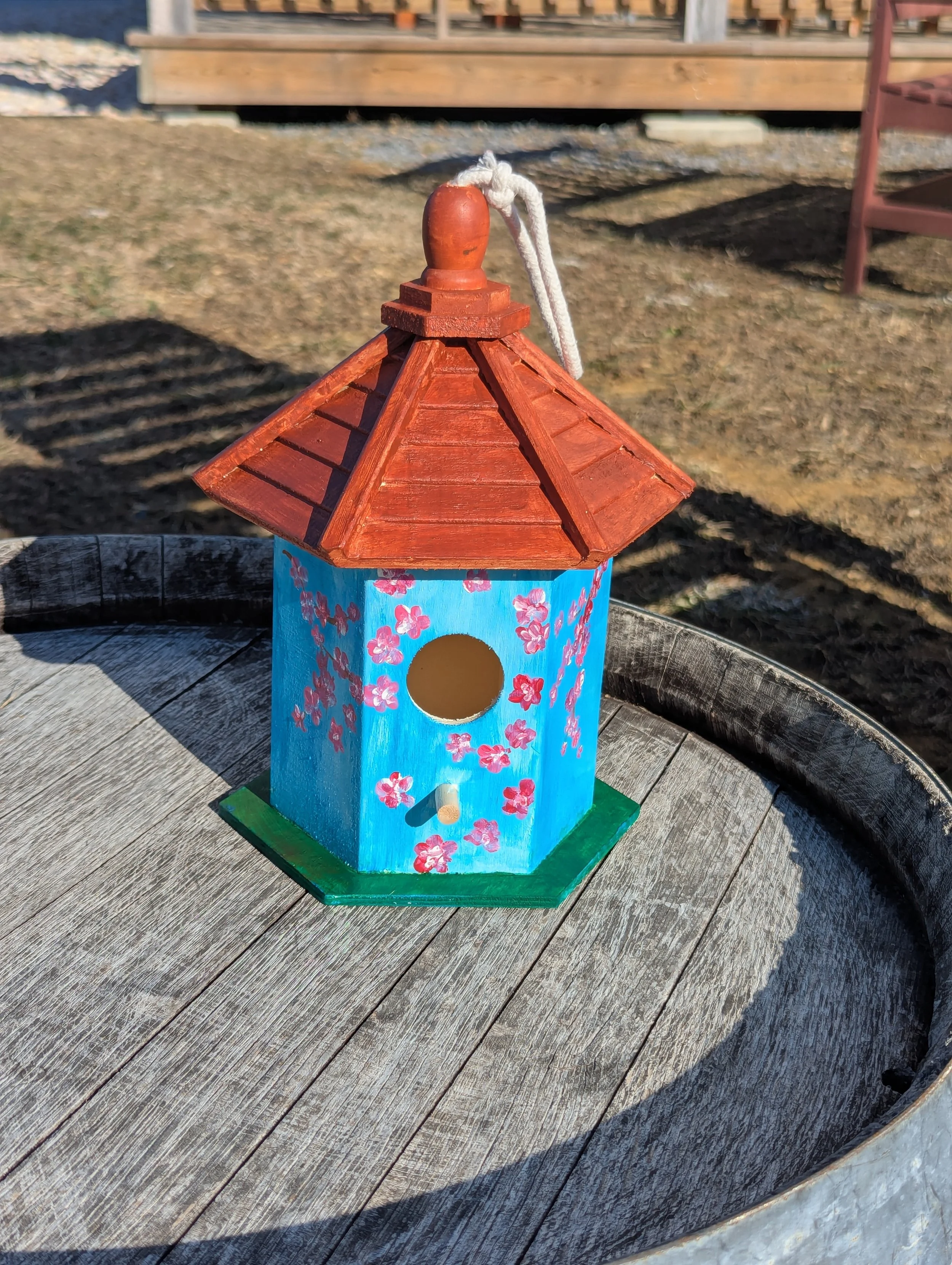 A Paint & Sip bird feeder by the Red Apron Artist
