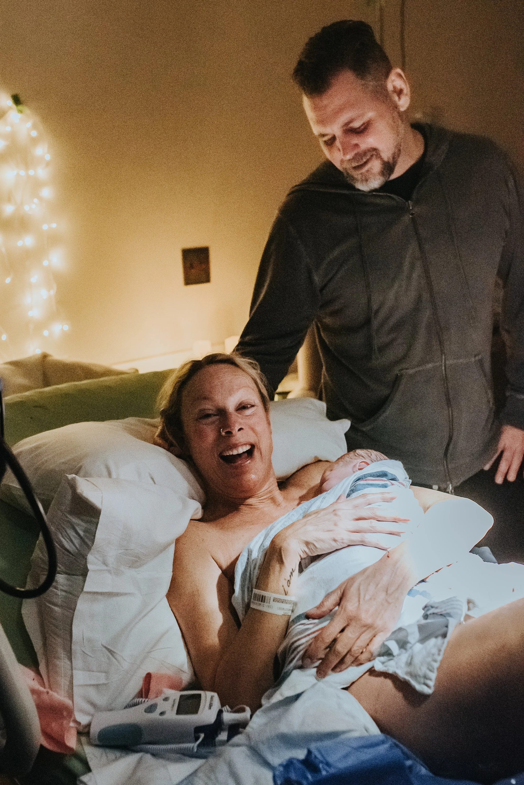 Mother embraces her baby for the first time in awe of her triumph documented by Los Angeles birth photographer Dear Birth