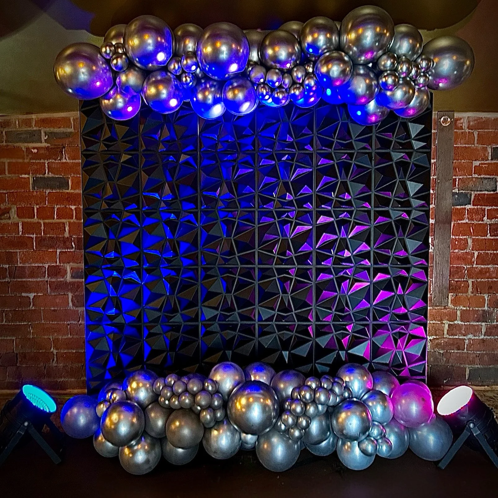 geometric wall backdrop and balloons