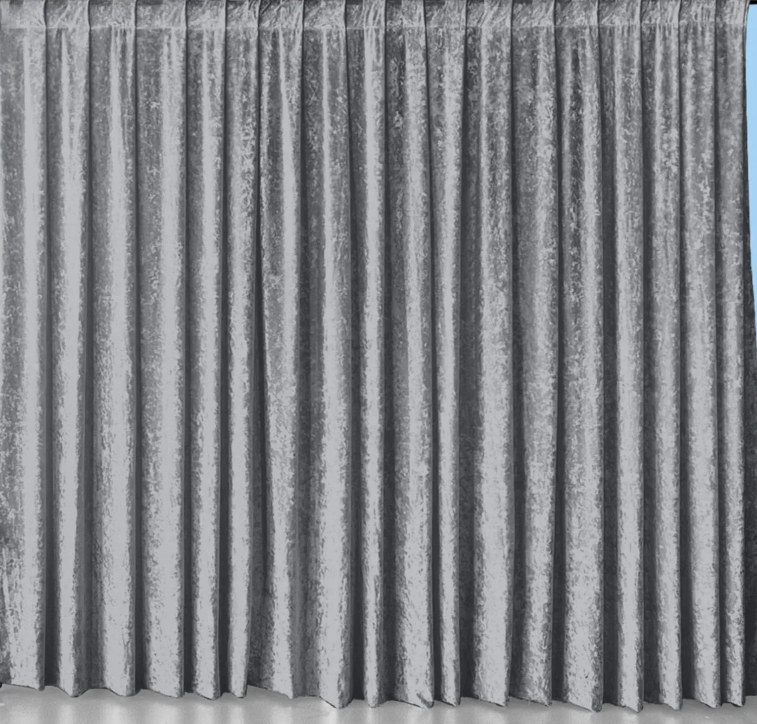 Silver metallic curtains hanging vertically.