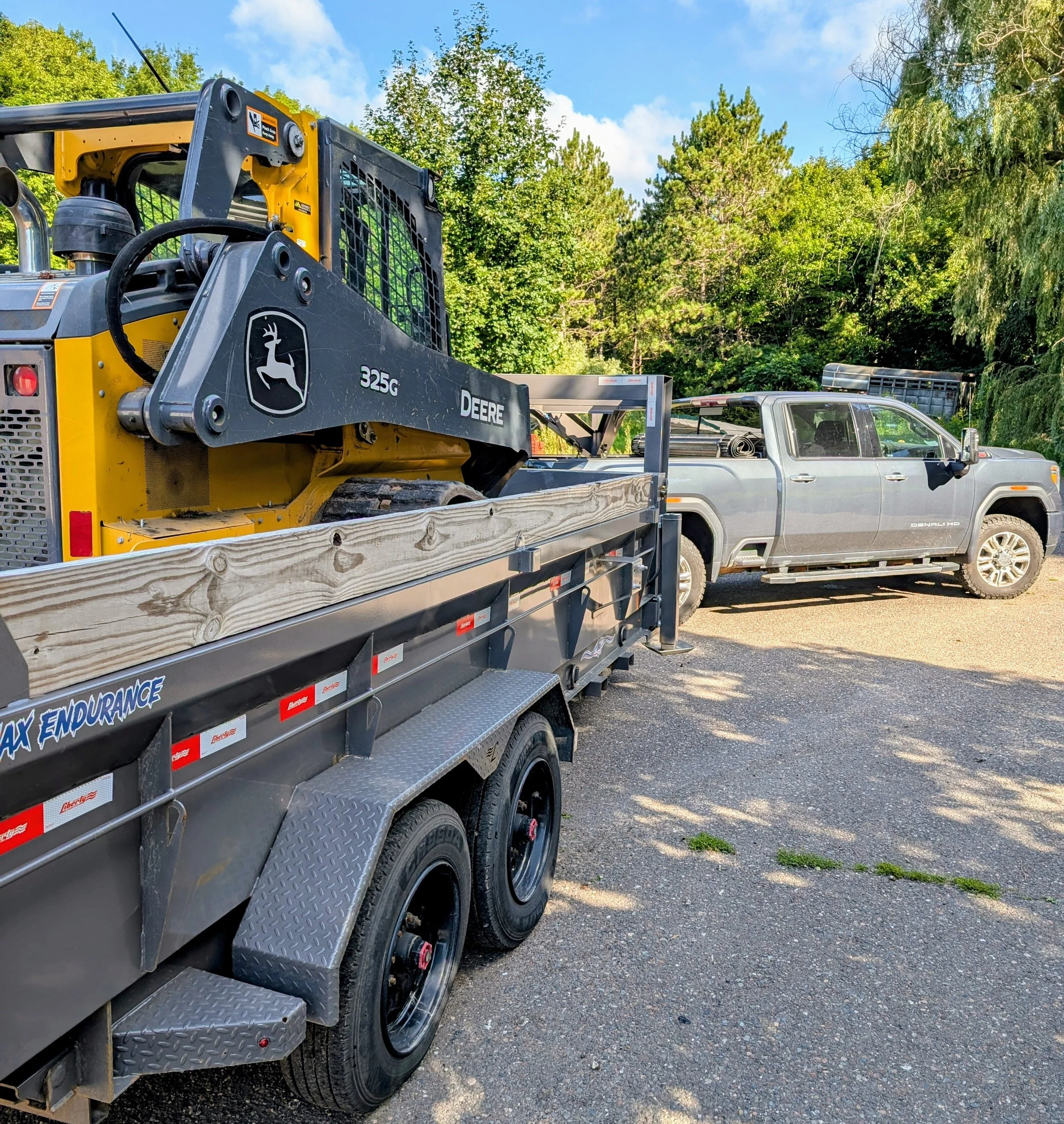 Skid Steer Work and Dump Trailer Hauling