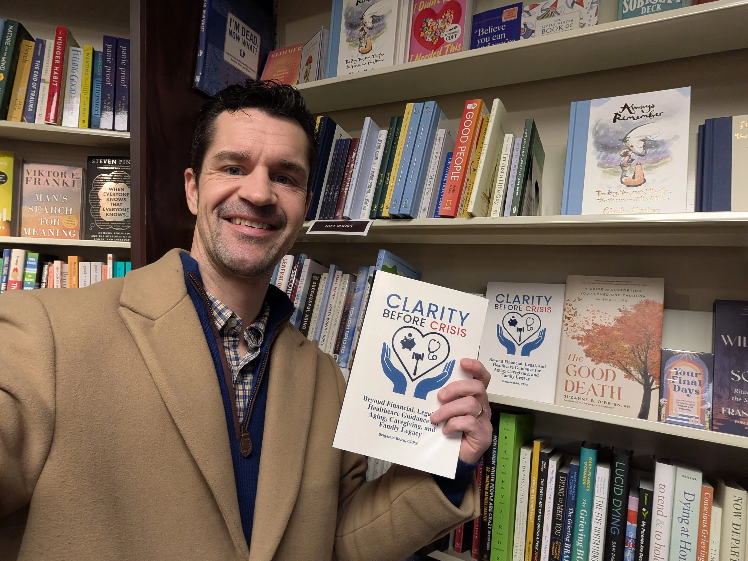 Ben Bolen posing with his book at Schuler Books in Ann Arbor.
