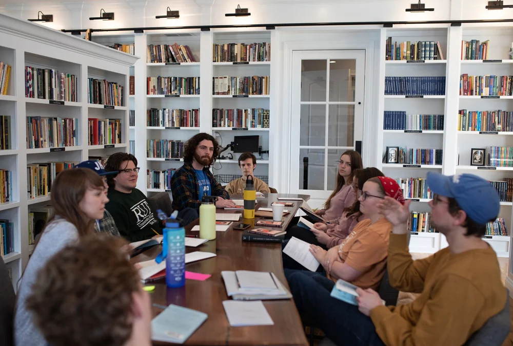Students reading together around a table
