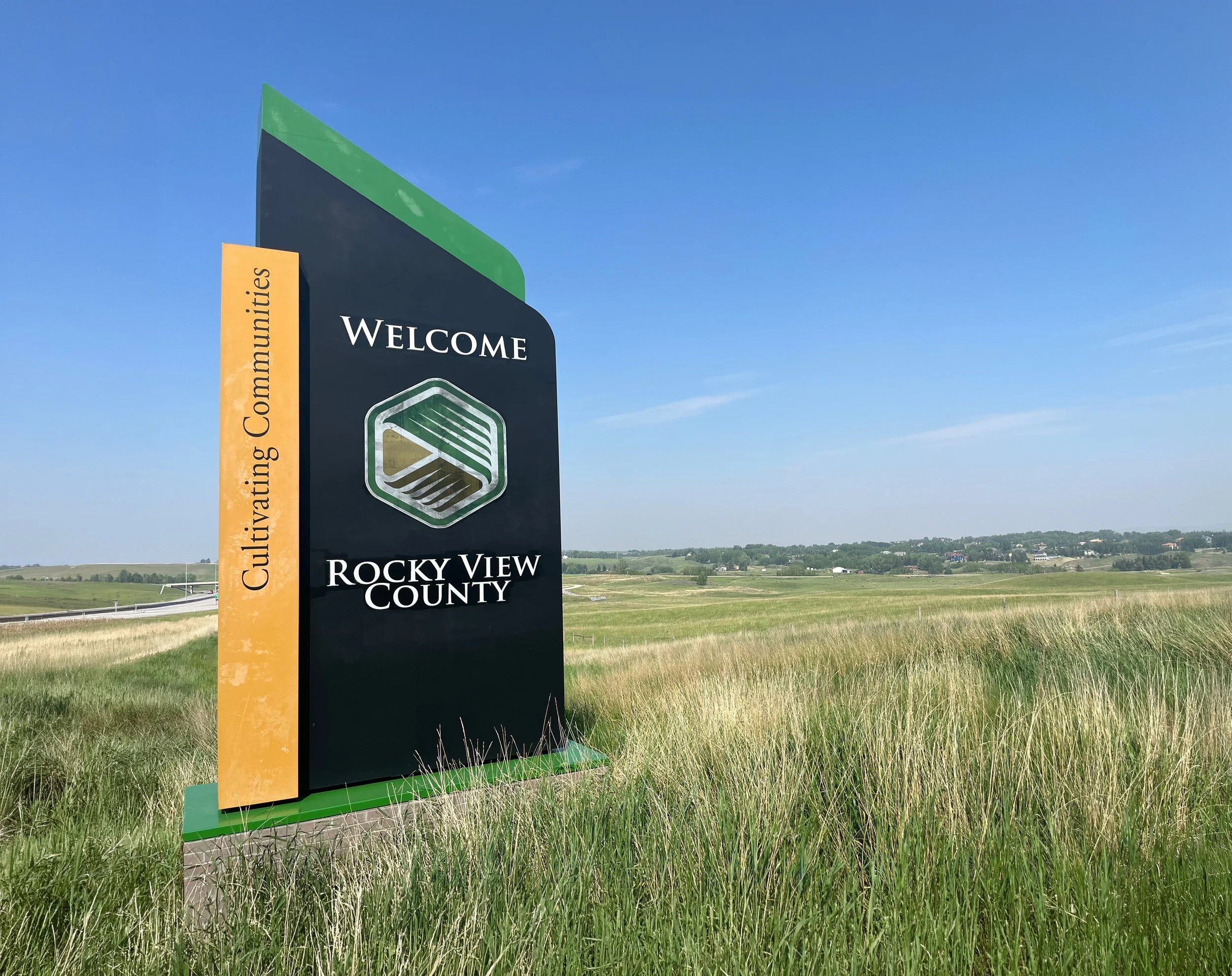 Sign welcoming visitors to Rocky View County with text about cultivating communities.