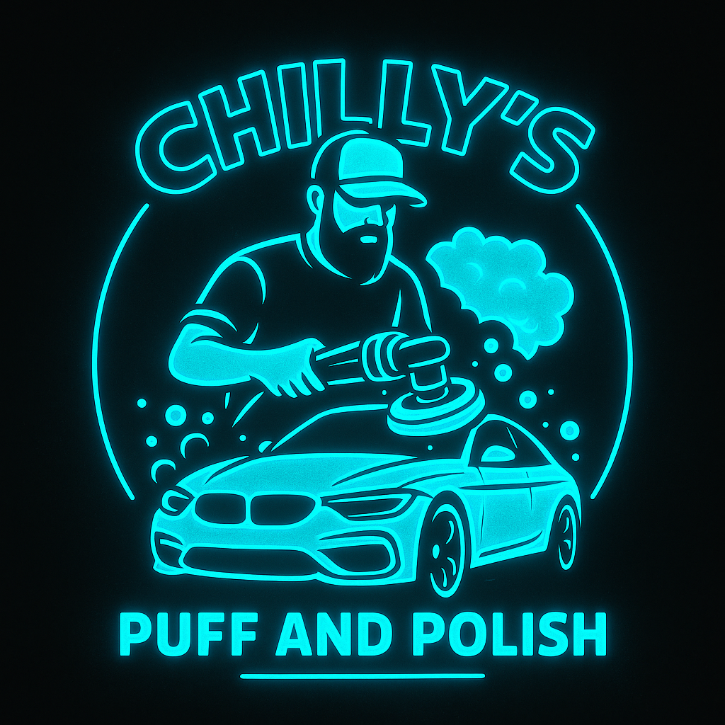 Neon sign featuring a man polishing a car with a buffer, with a cloud of polish foam and the text 'Chilly's Puff and Polish'.