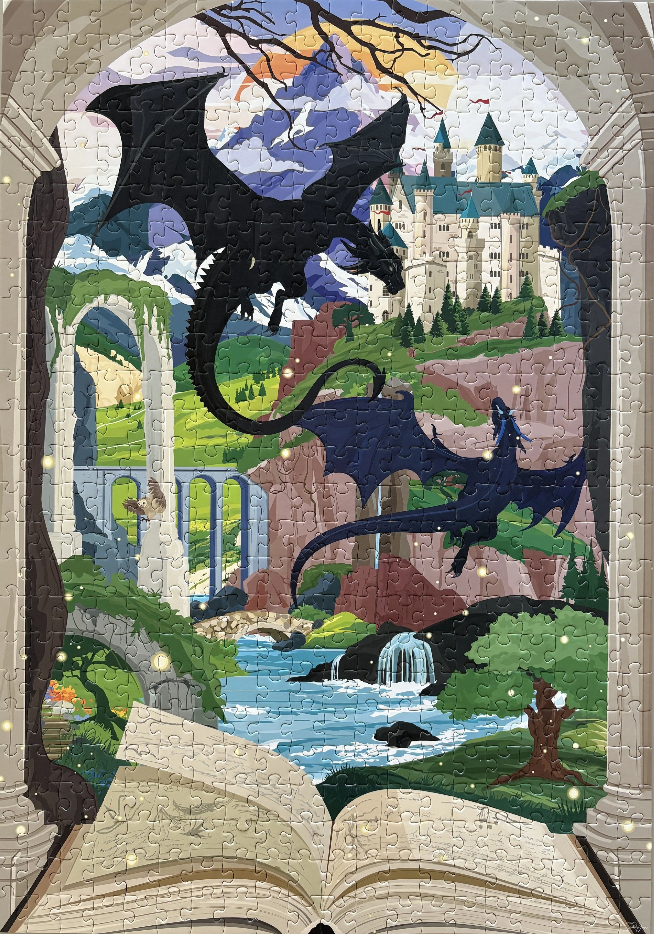 Finished puzzle featuring a fantasy landscape with a castle and two flying dragons