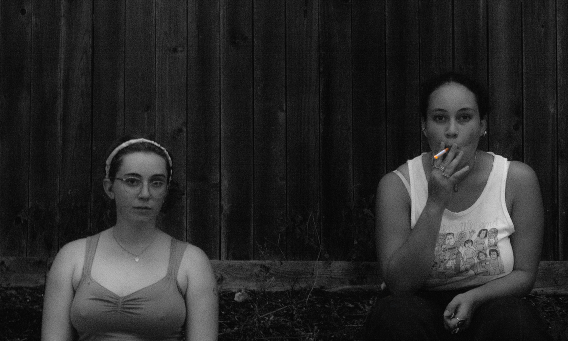 M&R: Friends Meg and Roberta having a cigarette break as we clean our newly rented duplex.