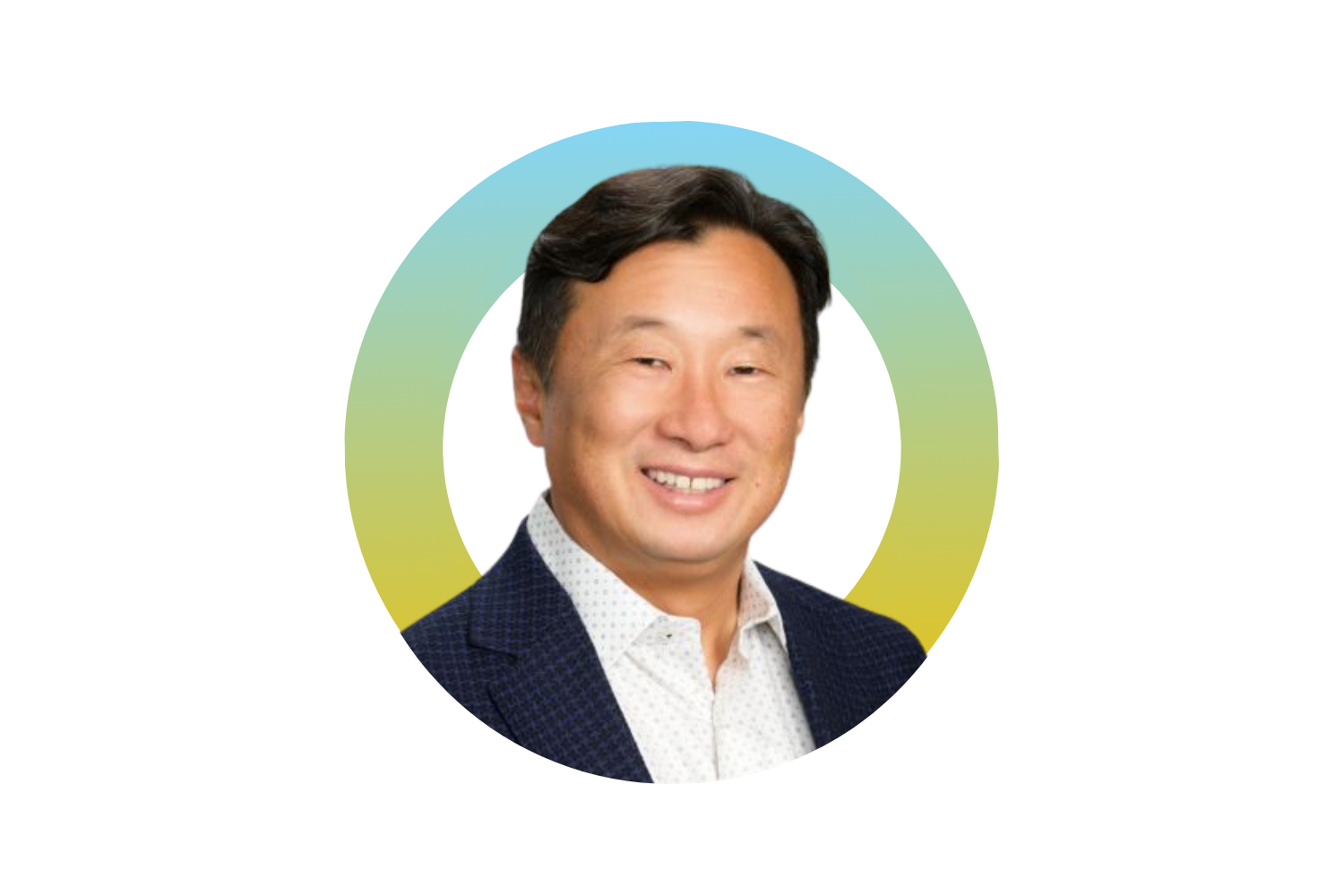 Headshot of a smiling man with dark hair, wearing a dark blazer and a white button-up shirt, set against a colorful, abstract background.