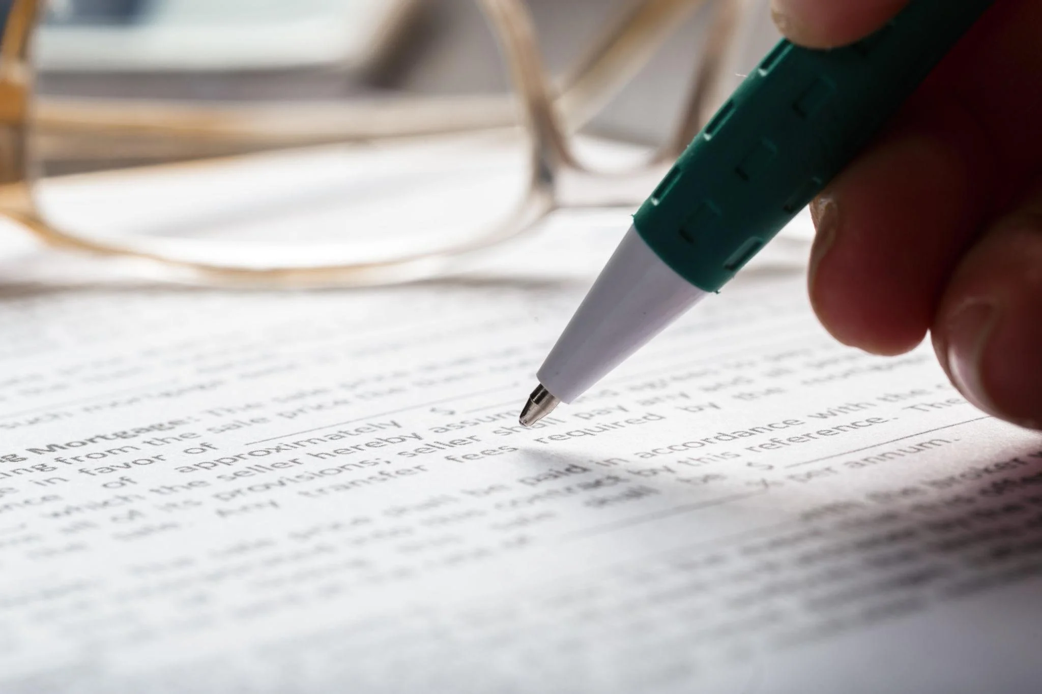 Close-up of trust agreement clauses being reviewed for estate planning and tax planning purposes