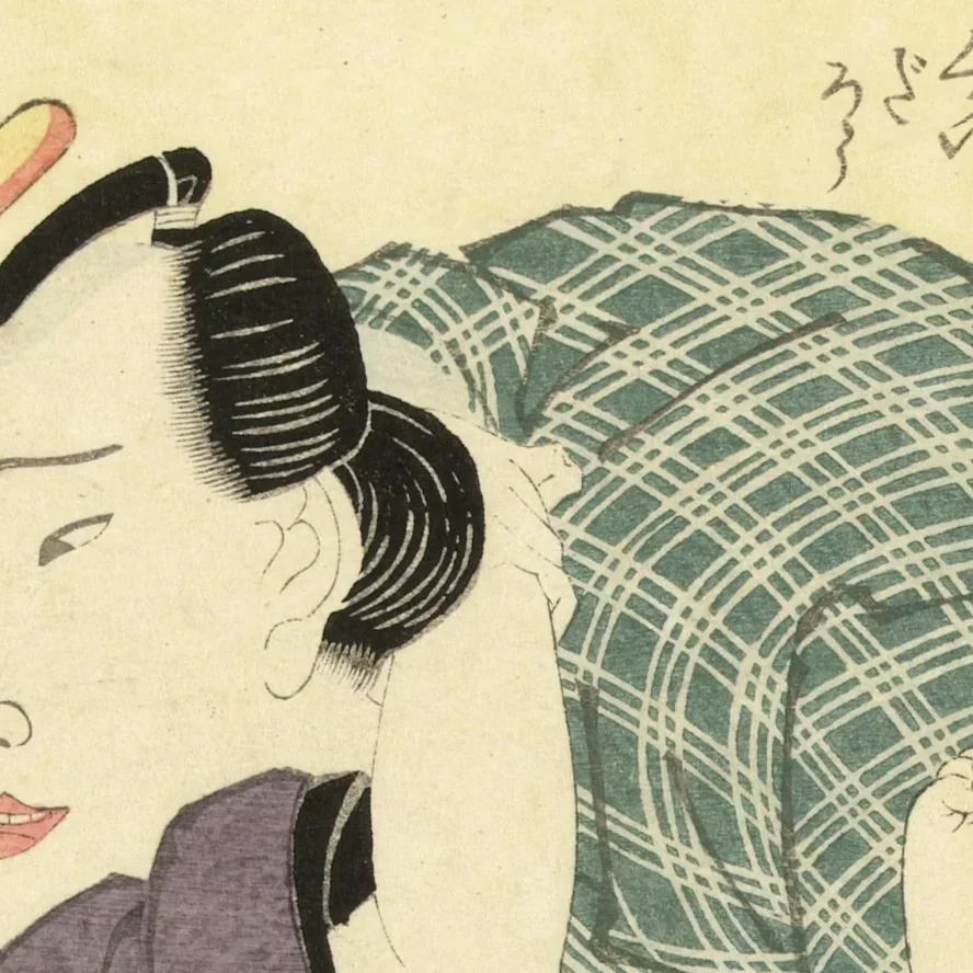Close-up of a traditional Japanese artwork depicting a woman with styled black hair and a patterned kimono.