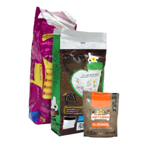 Assorted snack and candy packages, including gummy candies, chocolate, and fruit chews.