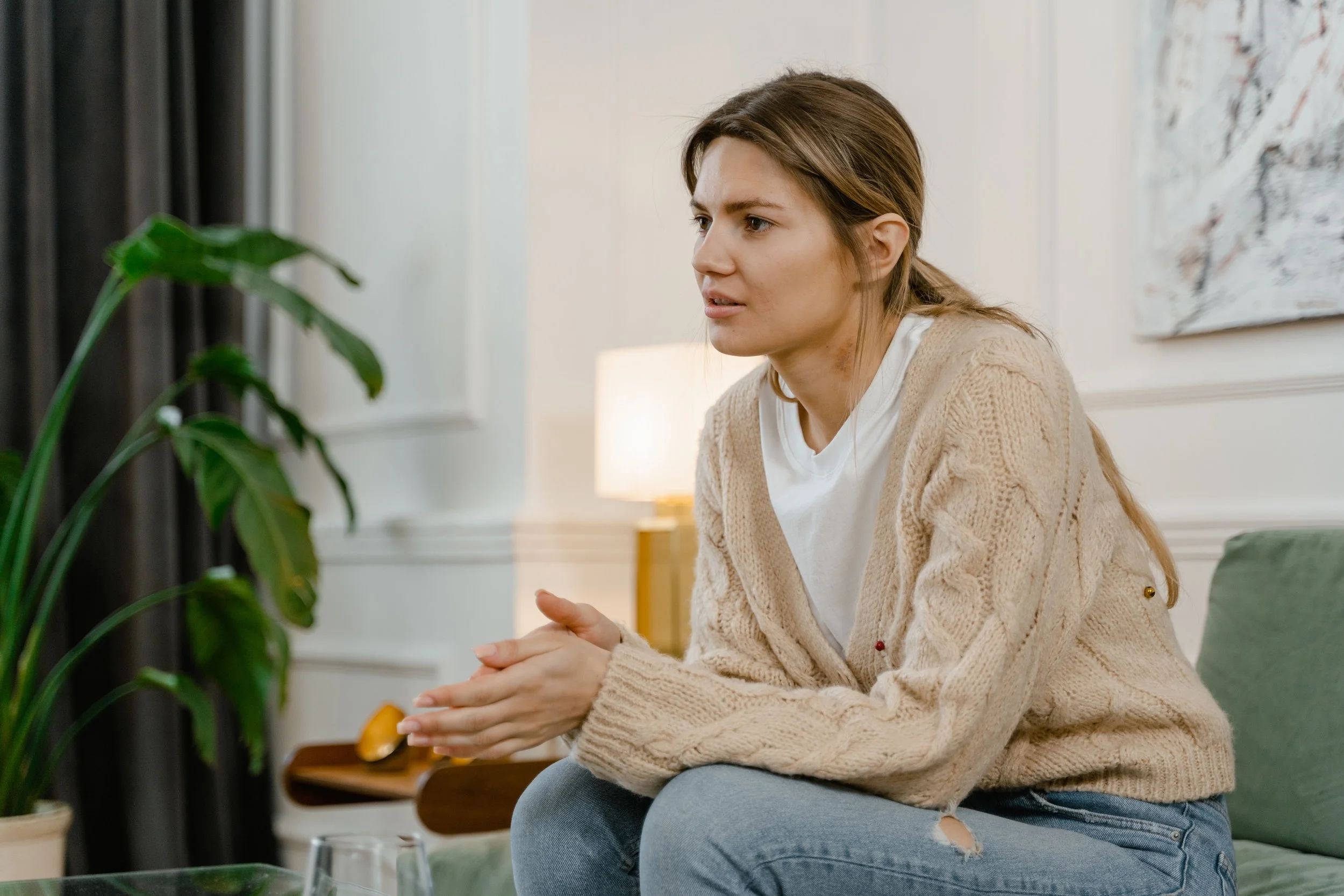woman sitting and appearing to talk to someone