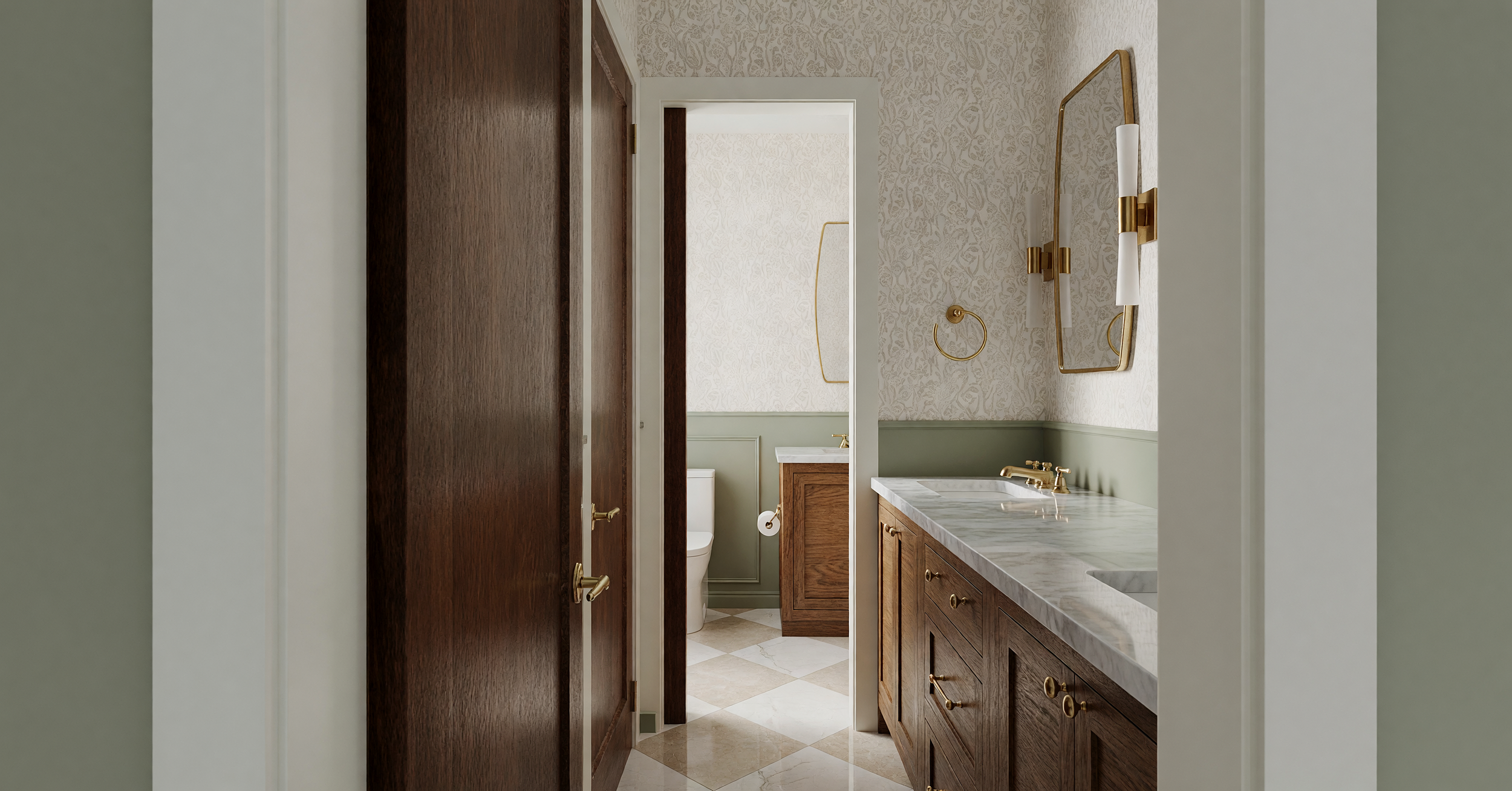 A view of a bathroom seen through an open door. The bathroom has a wooden vanity with a marble countertop, a brass faucet, and a mirror with brass fixtures. In the background, there is a toilet and a small cabinet, all with brass accents. The walls have a patterned wallpaper and the floor has a tiled diamond pattern.