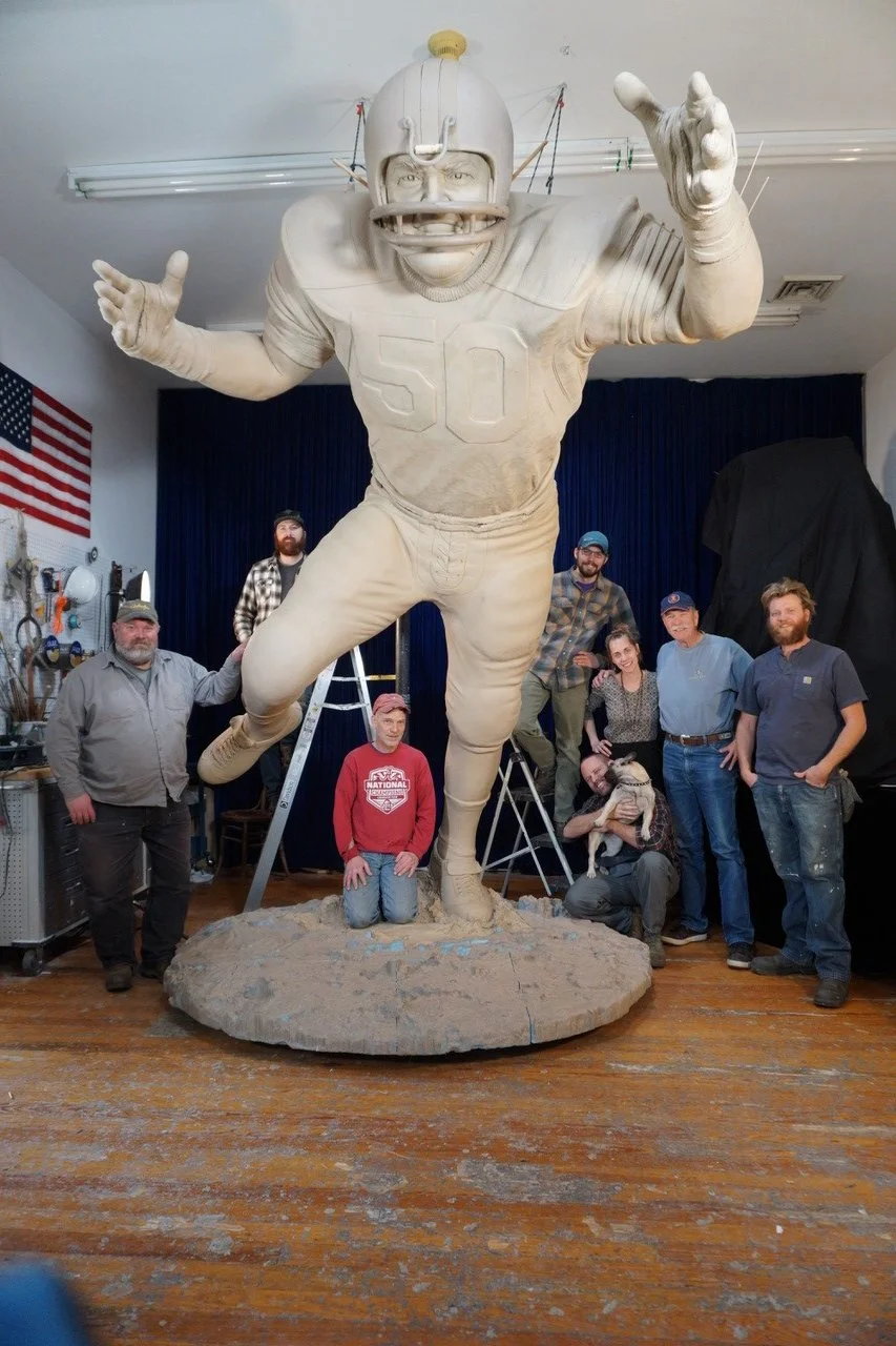 Butkus in clay w crew.jpg
