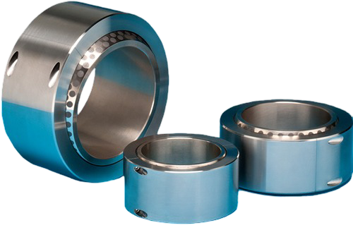 Three metal ball bearings of different sizes on a plain background.