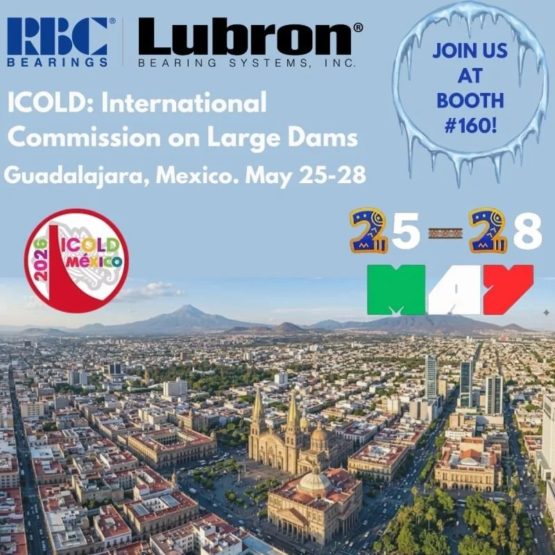 An aerial view of downtown Guadalajara, Mexico, with mountains in the background. The image promotes the ICOLD 2022 conference on large dams, taking place May 25-28, with logos of RBC Bearings and Lubron Bearing Systems, and an invitation to join at booth 160. The date and location are displayed with colorful graphics.