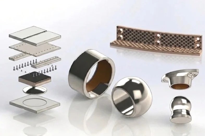 Disassembled electronic or mechanical components including metal rings, circuit board, and heat sinks.