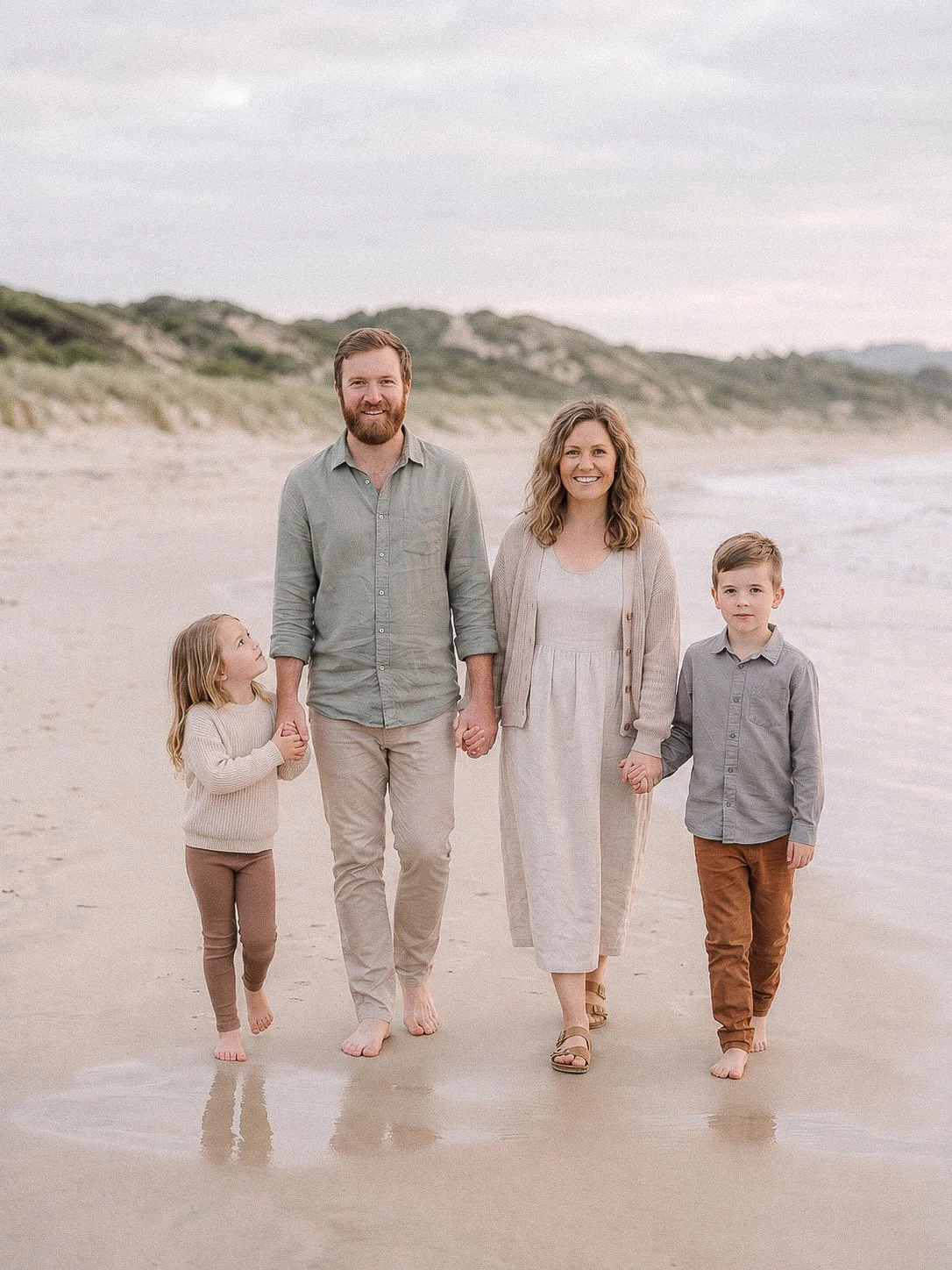  Family standing together at the beach 
