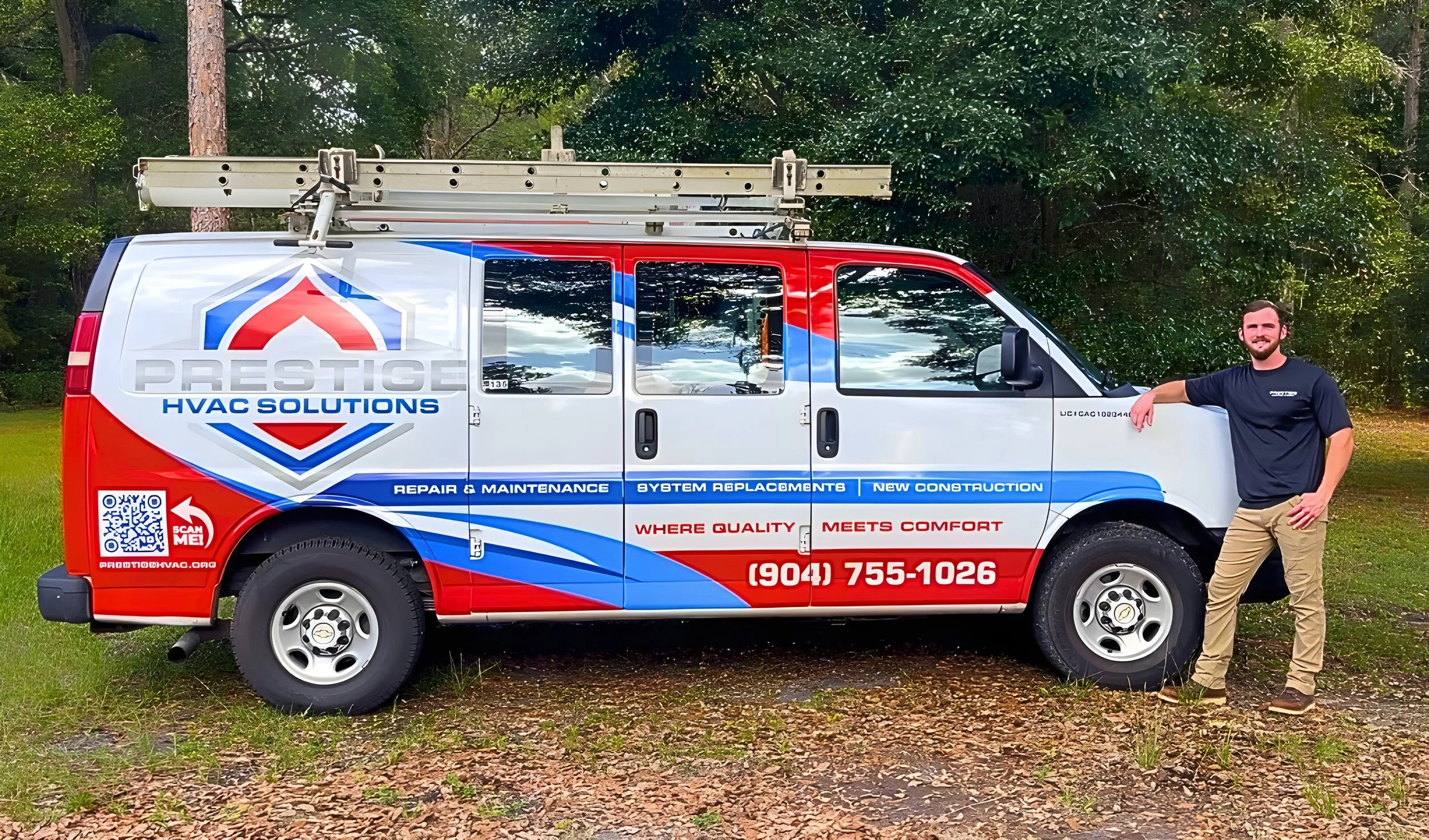 Prestige HVAC Solutions owner beside company service van in Starke, Florida