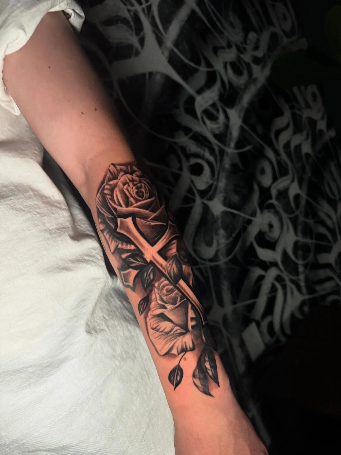 Black and grey roses with cross . Such a fun tattoo I love doing black and gray thanks bro. Had a good time. Hope you love your tattoo.