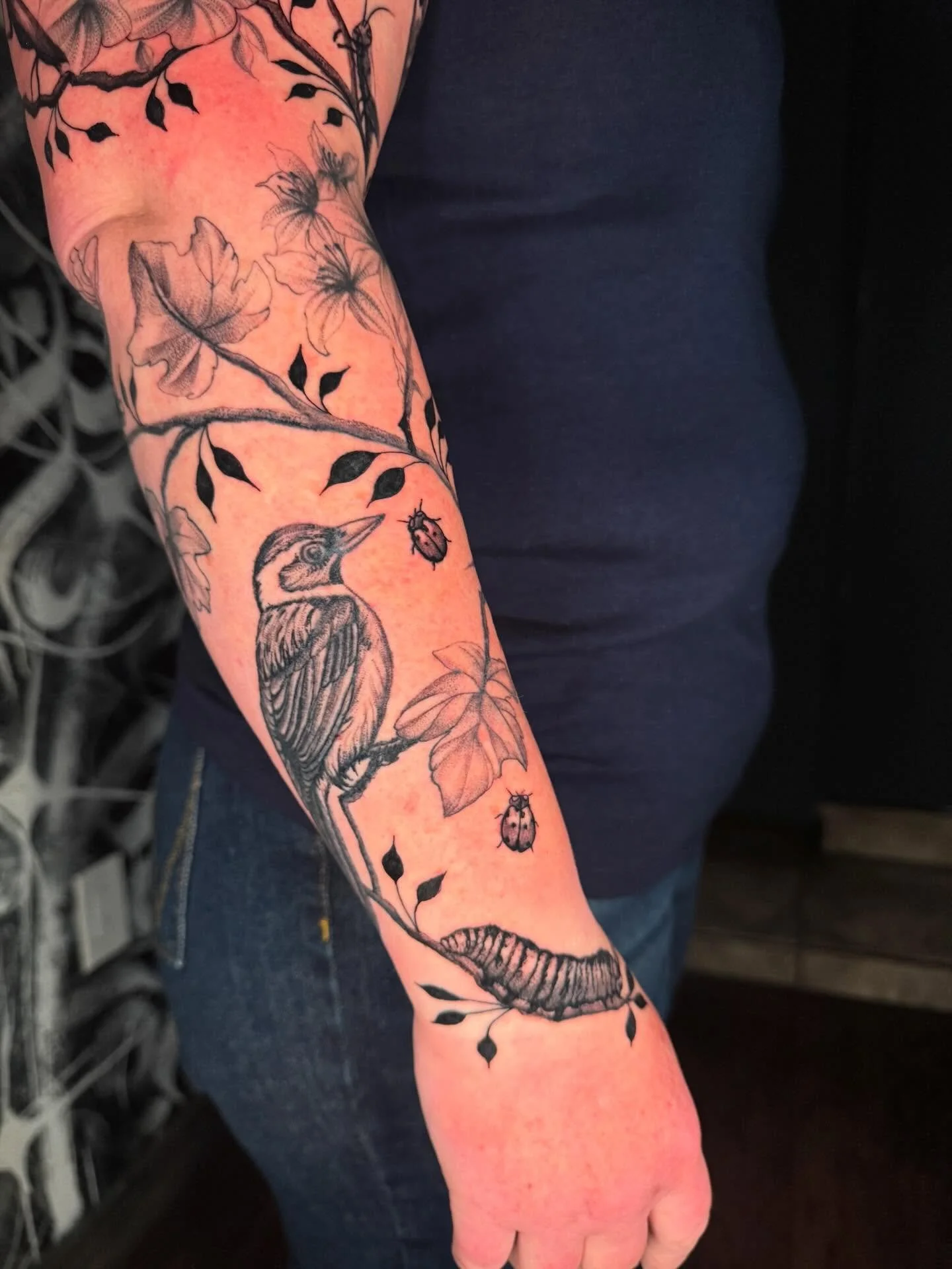 Bird and insect tattoo with floral