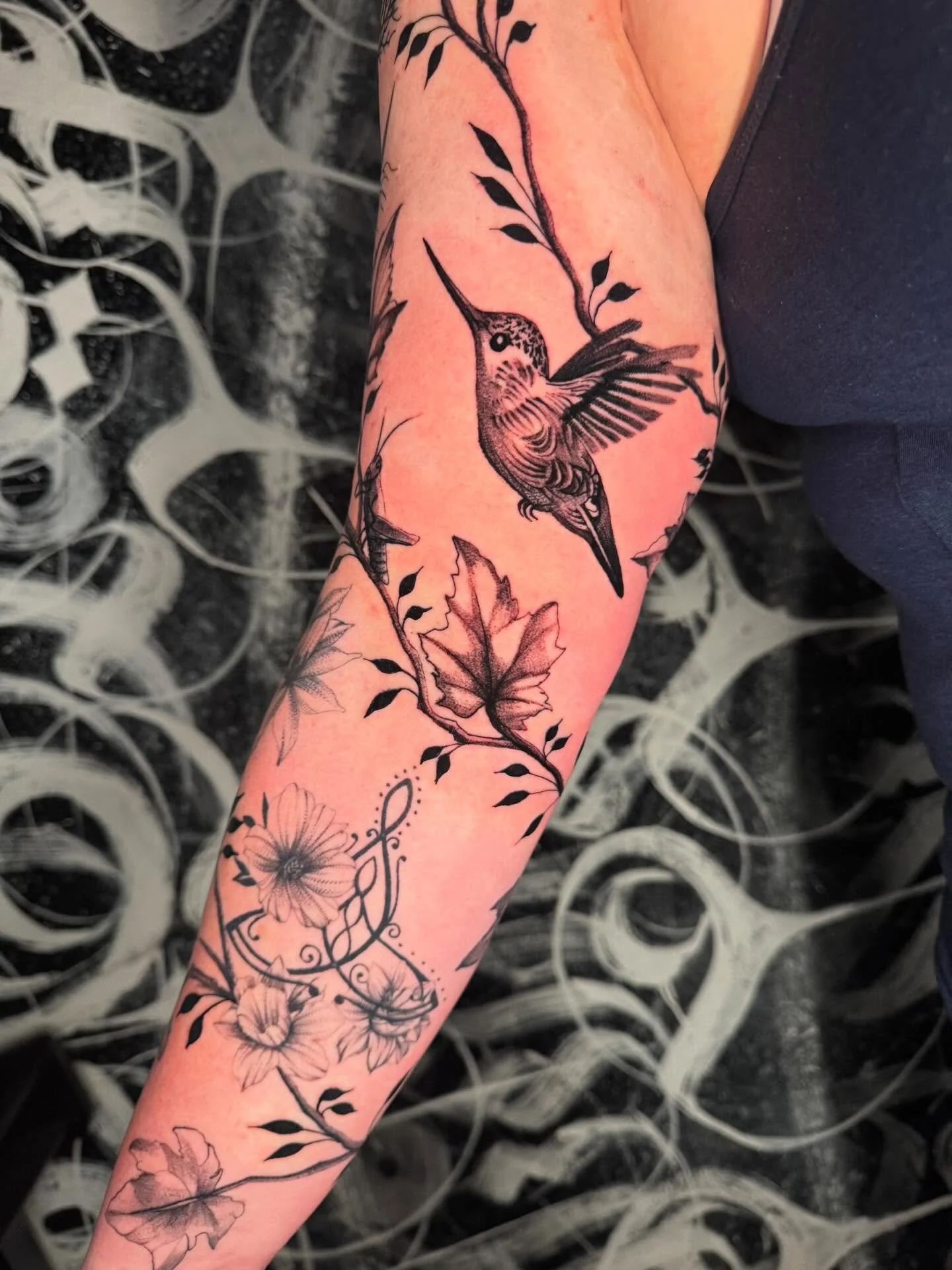 Bird and floral tattoo