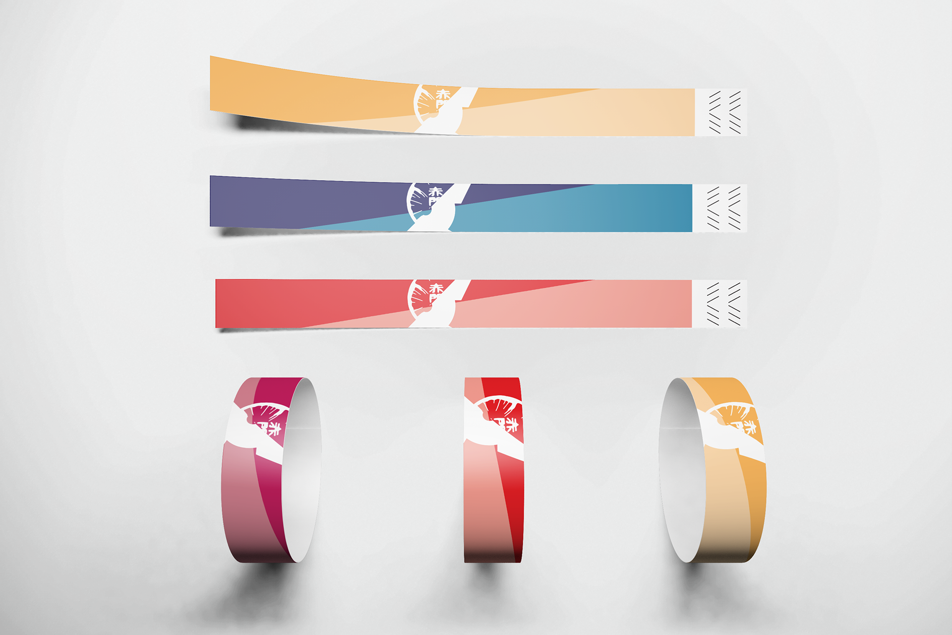 Four strips of washi tape with wave designs and snowflake motifs, in beige, blue, red, and pink, arranged vertically, and three rolls of tape in matching colors below.