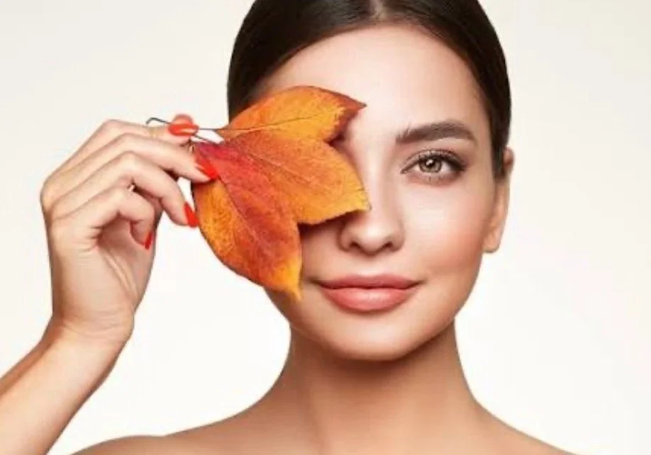 Woman holding an autumn leaf, MG Natural Beauty fall skincare