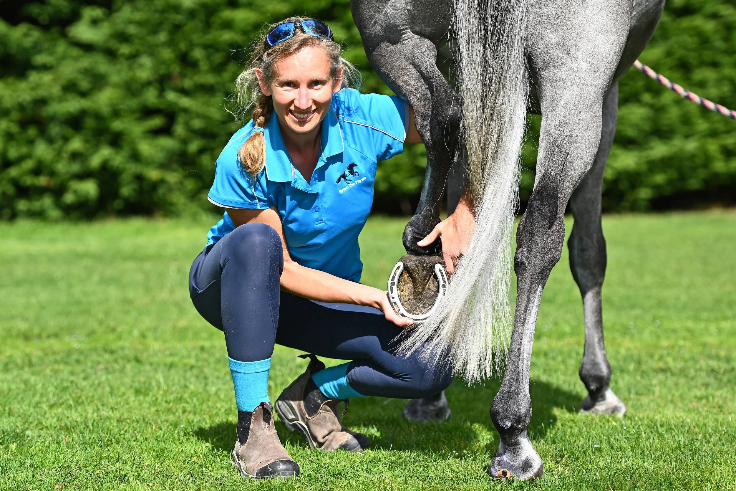 Helen the Physiotherapist working with grey horse
