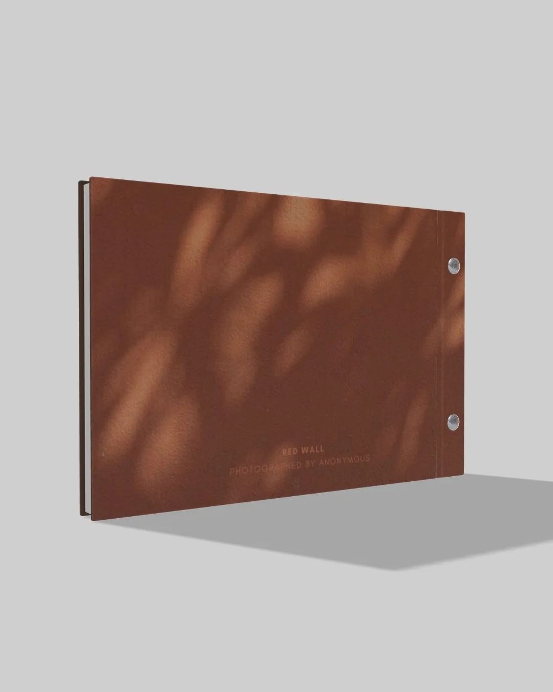 hardcover booklet with orange and brown aesthtic from back side