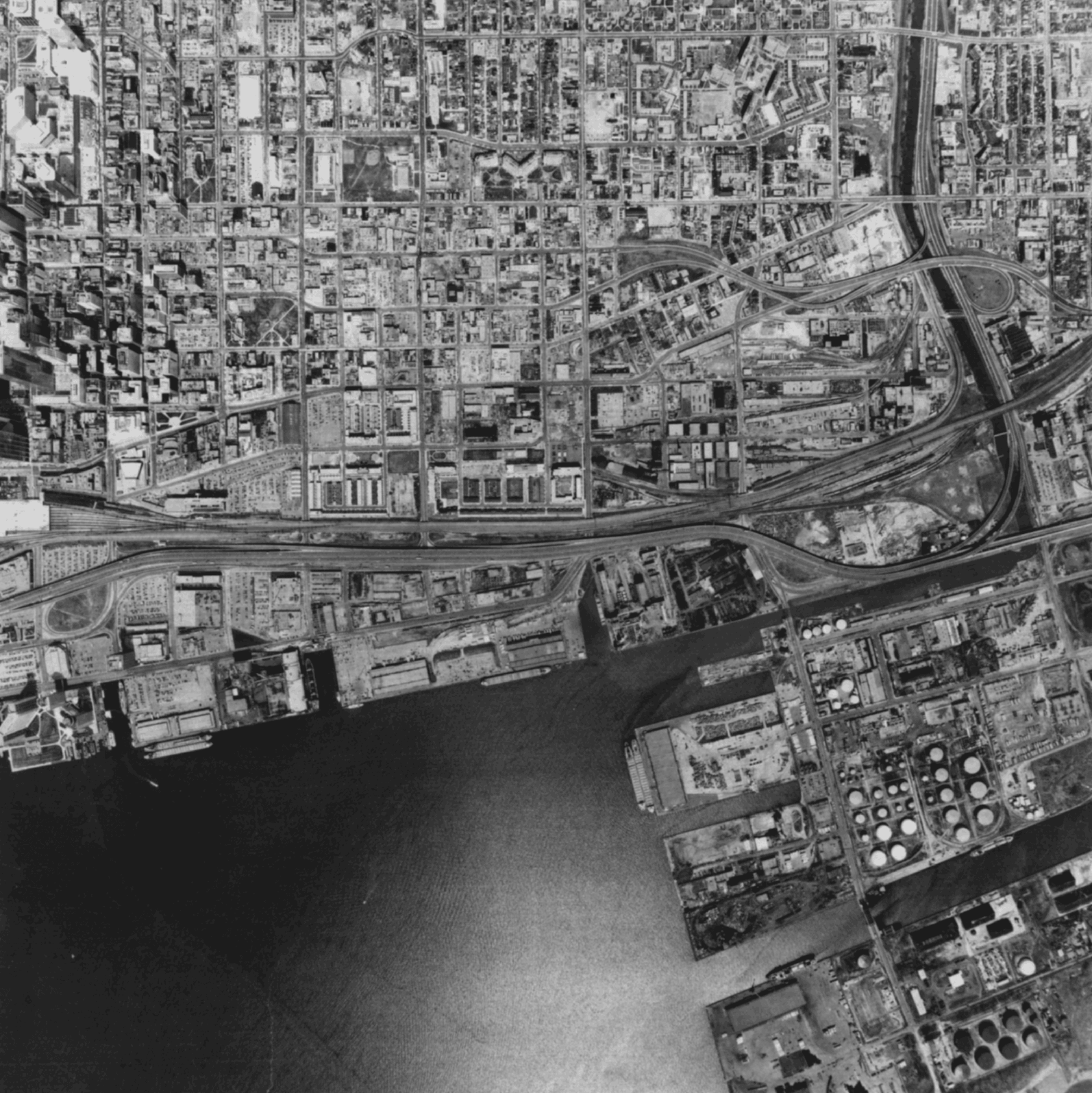 Black and white aerial photograph of the Toronto cityscape.
