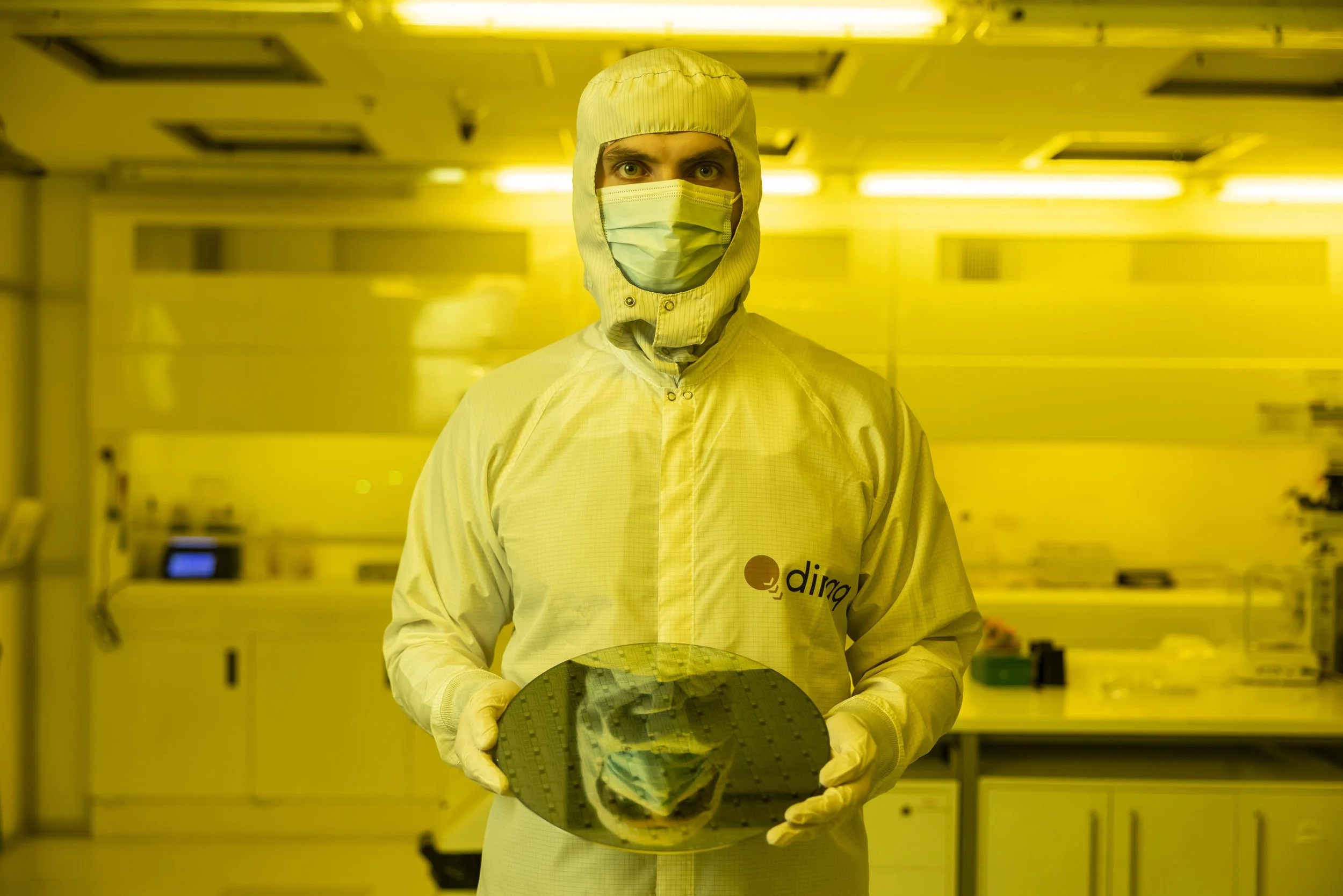 Industry-compatible silicon spin-qubit unit cells exceeding 99% fidelity