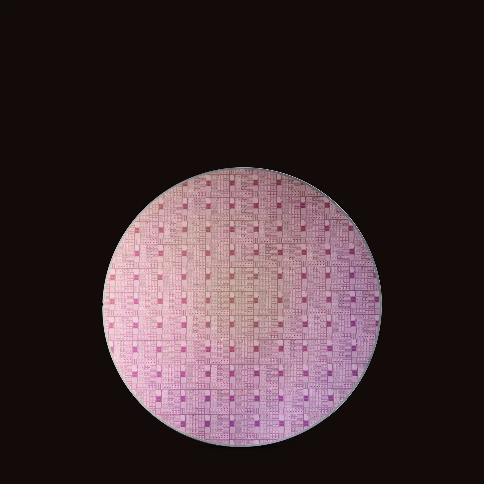 Close-up of a computer microchip with intricate circuitry, set against a black background.