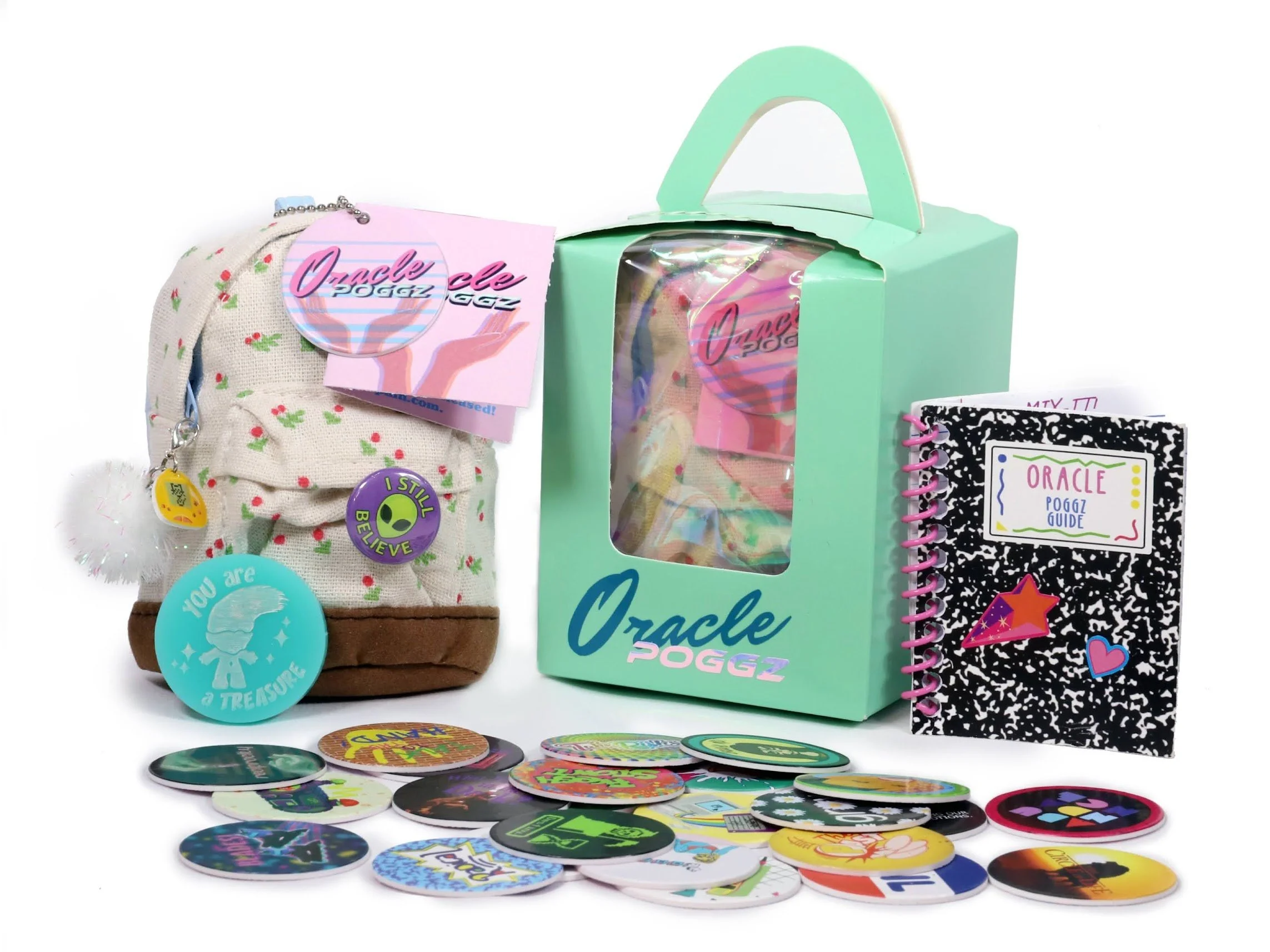 A collection of colorful buttons and stickers, a small fabric bag with patches, a cardboard box with a handle, and a spiral notebook with a sticker-covered cover.
