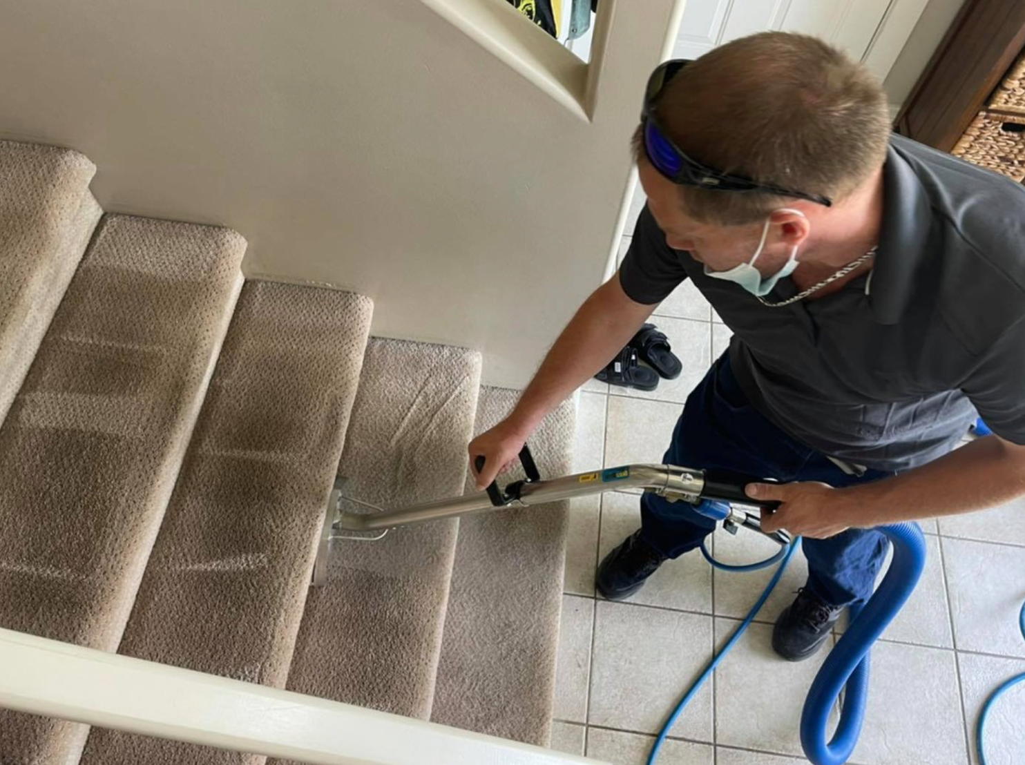 Buzz Brite Team Member is Carpet Cleaning stairs in a house in Vernon BC