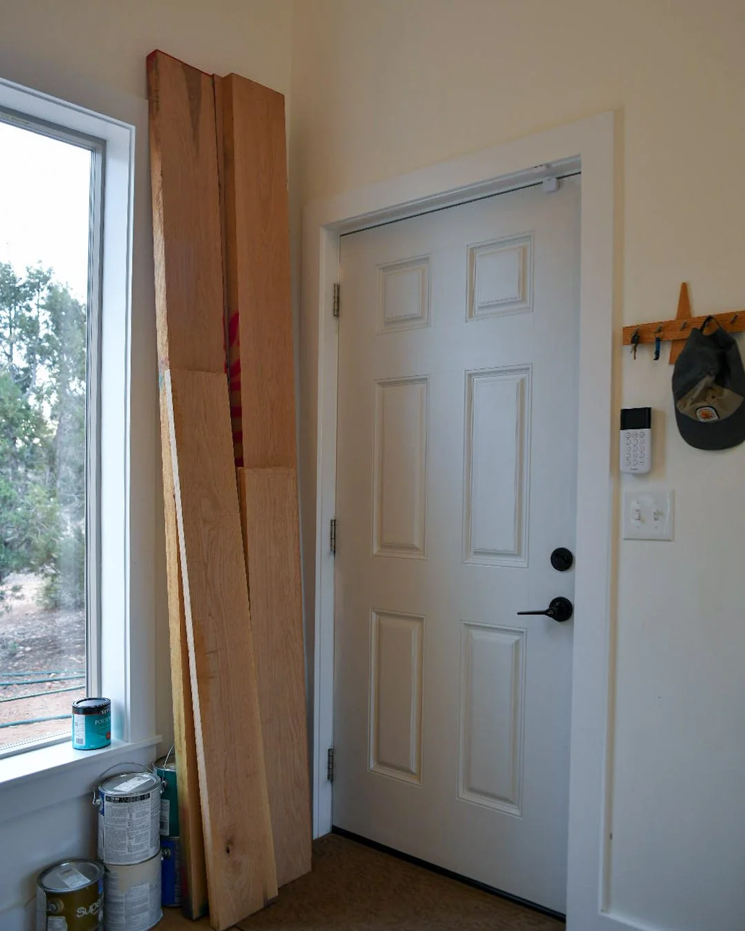 White oak acclimating inside home next to entrance door