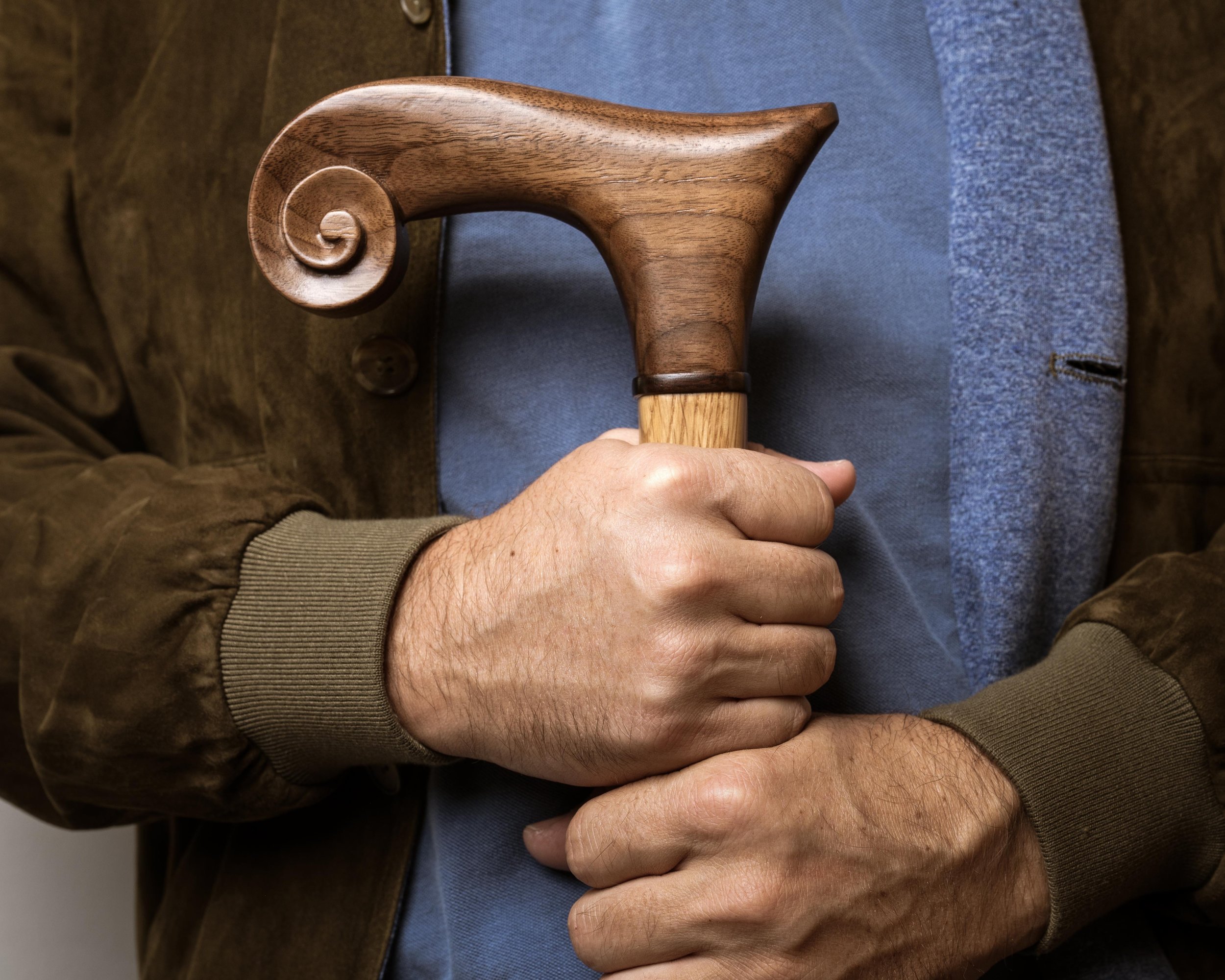 man-holding-walking-cane.jpg