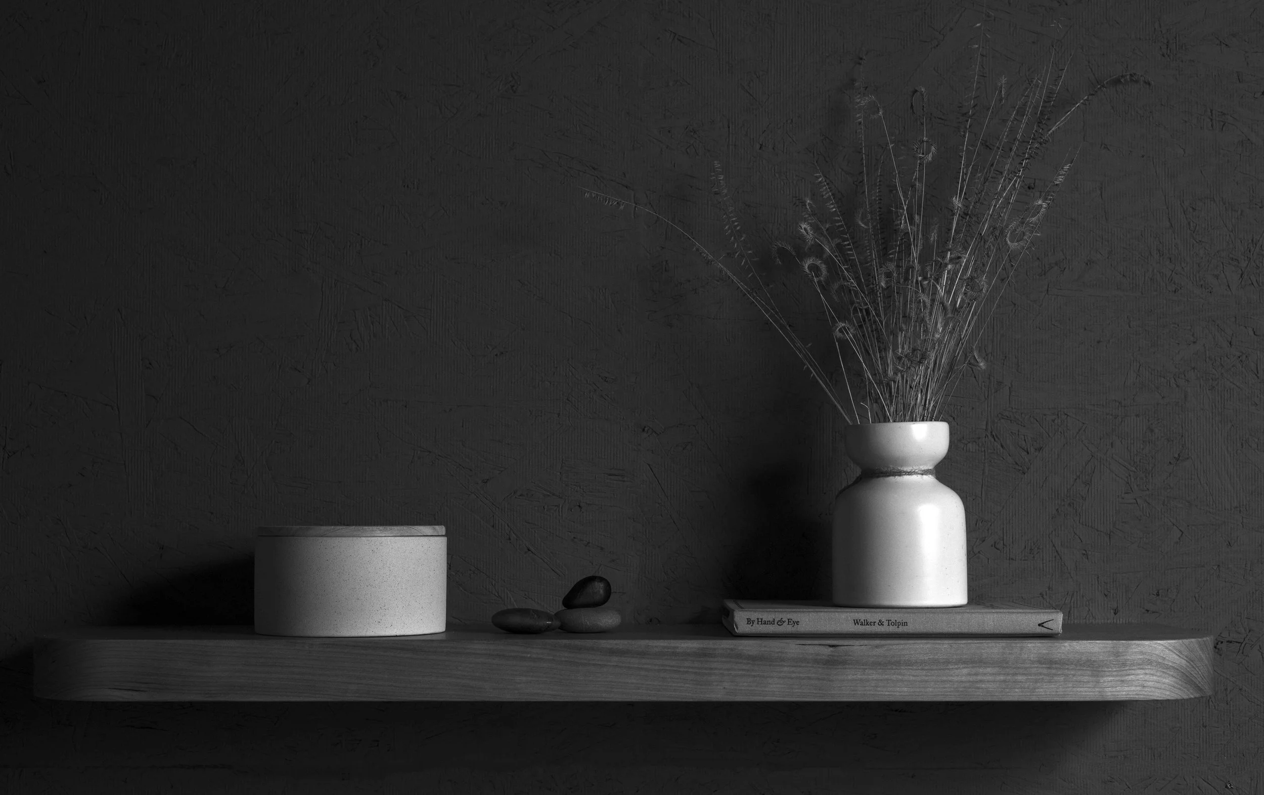 Floating shelf with plants and bowls
