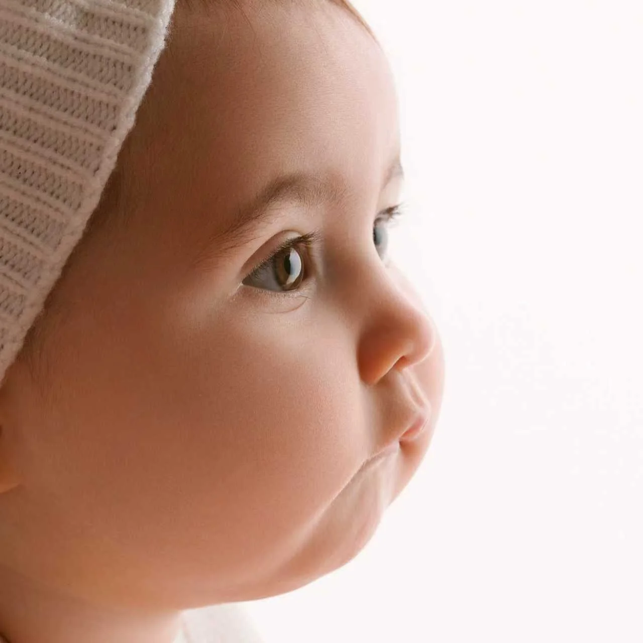 Chubby cheeks, curious eyes, and mum &amp; dad right where they should be.
Simple colours, soft light, and moments that feel real &mdash; not forced, not fancy.

These stages fly by quicker than you think.
Photos just help you hang onto them a bit lo