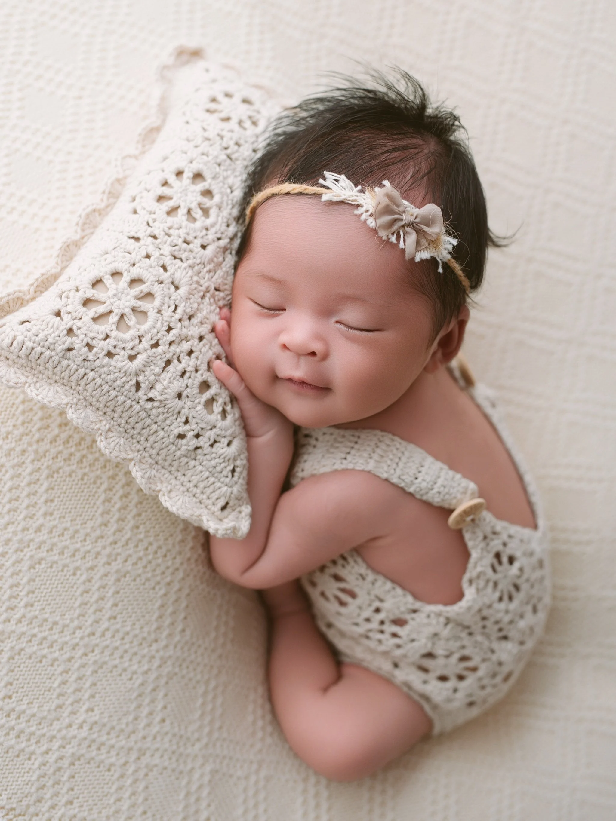 Tiny smiles, sleepy cuddles, and the sweetest little dreams.

This beautiful baby girl was so calm during her newborn session, giving us the most peaceful smile while snuggling her little crochet pillow. Moments this tiny change so quickly &mdash; so