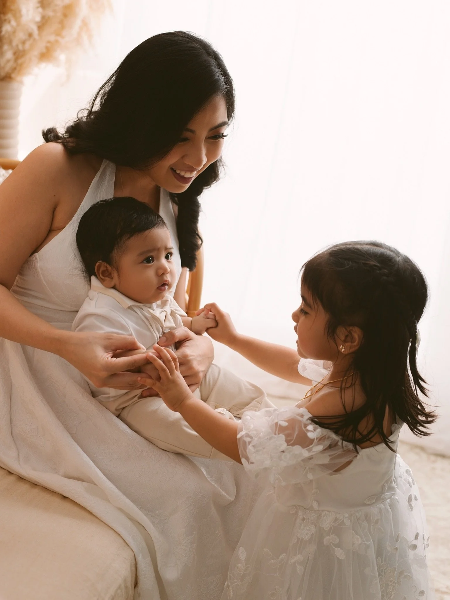 A beautiful family, a beautiful mum, and two little hearts growing together. 

Watching a big sister care for her baby brother is one of the sweetest things to witness. The gentle hugs, curious little hands, and proud smiles tell a story that words n